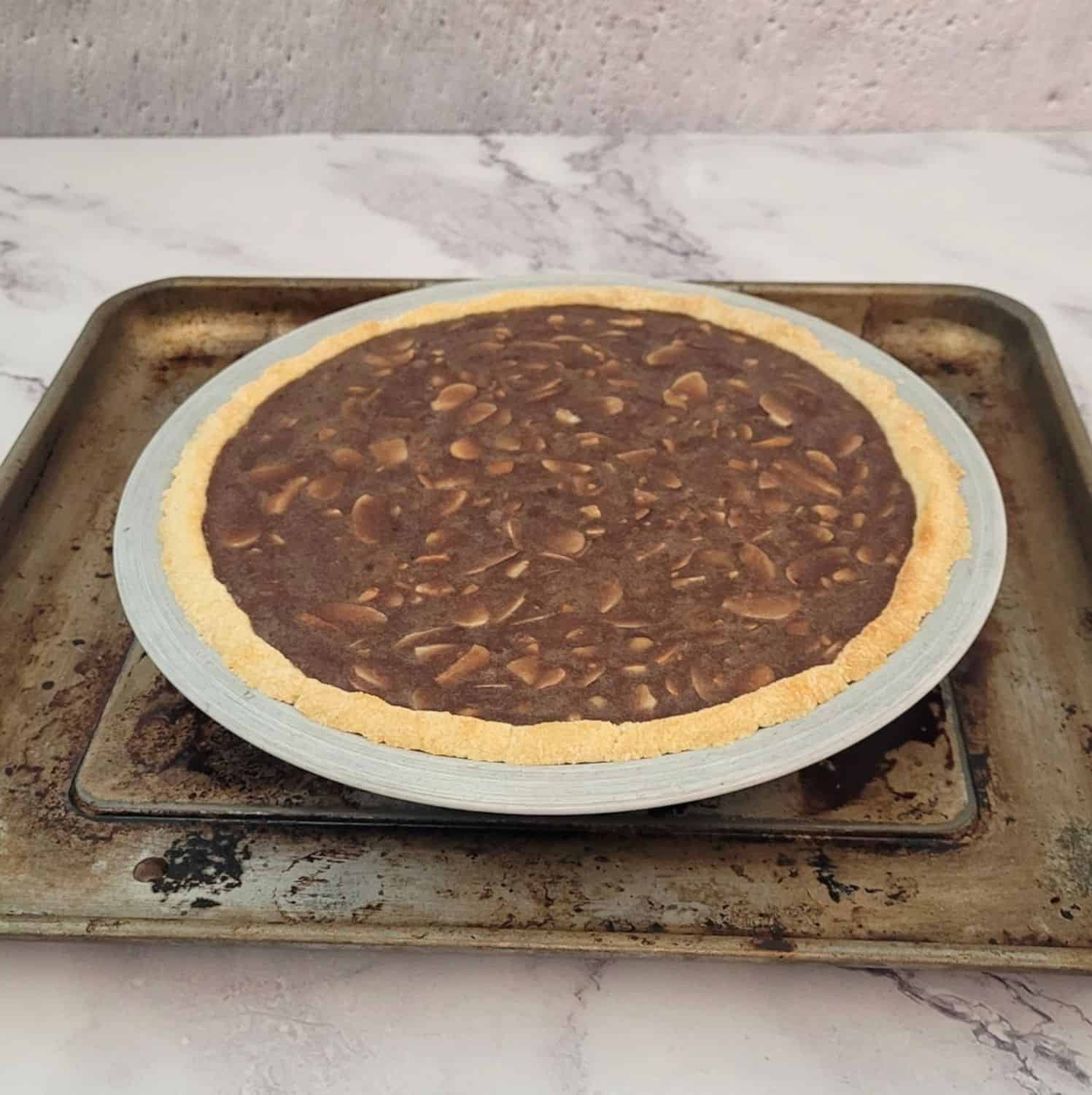 pie on a baking rack ready to go into preheated oven