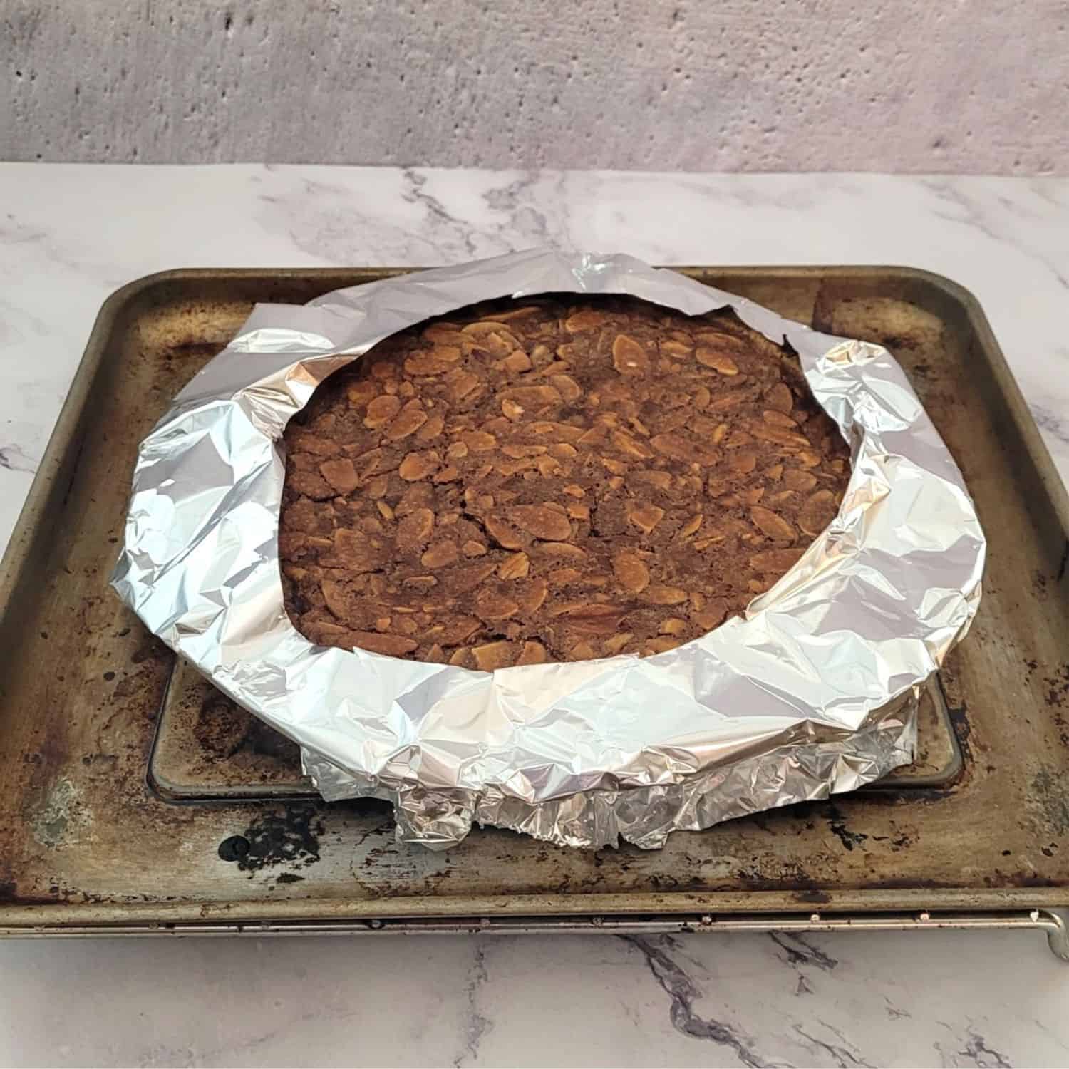 pie crust covered with aluminum foil to prevent from burning