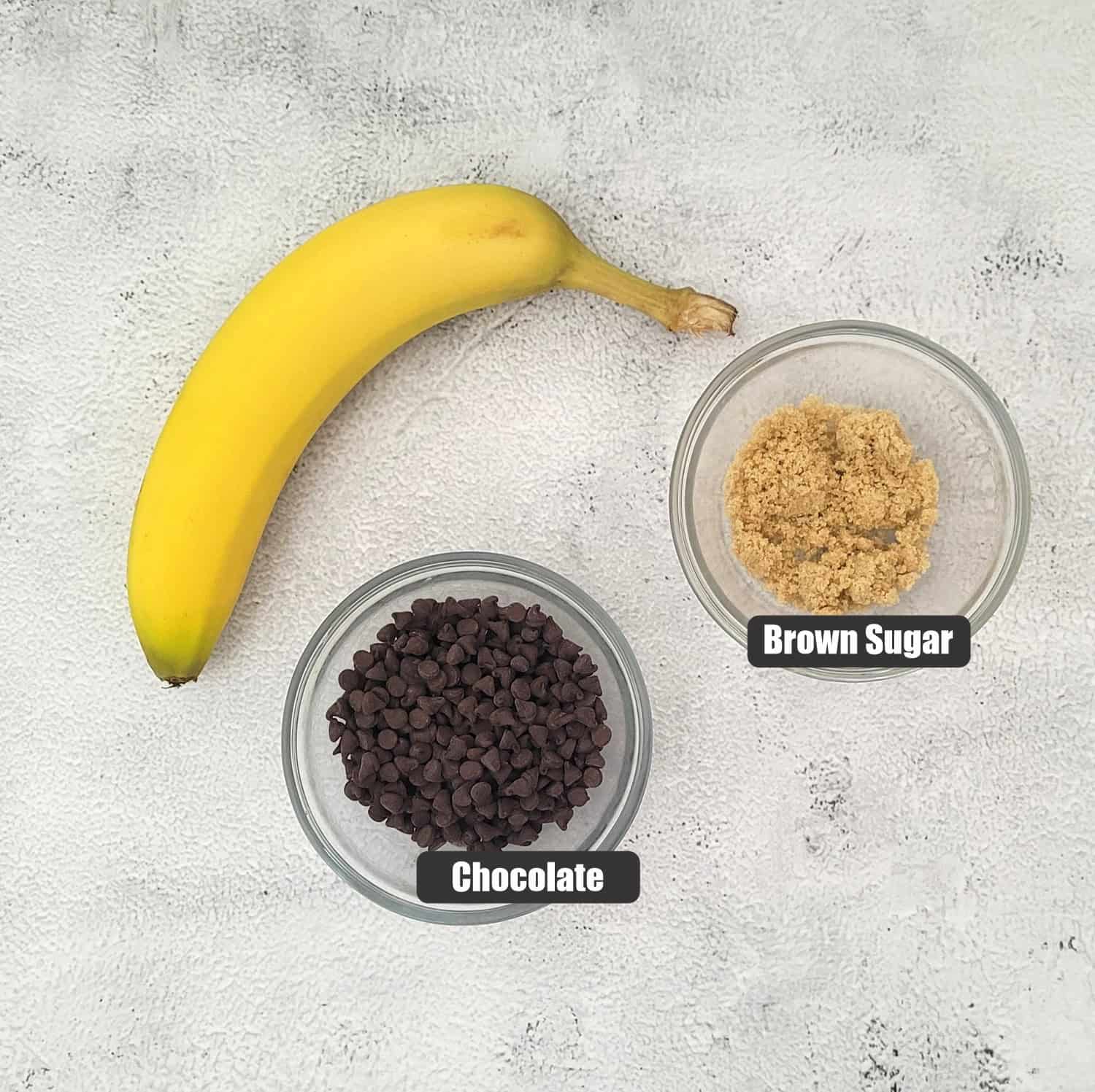 ingredients needed for cake filling including brown sugar, chocolate and a banana