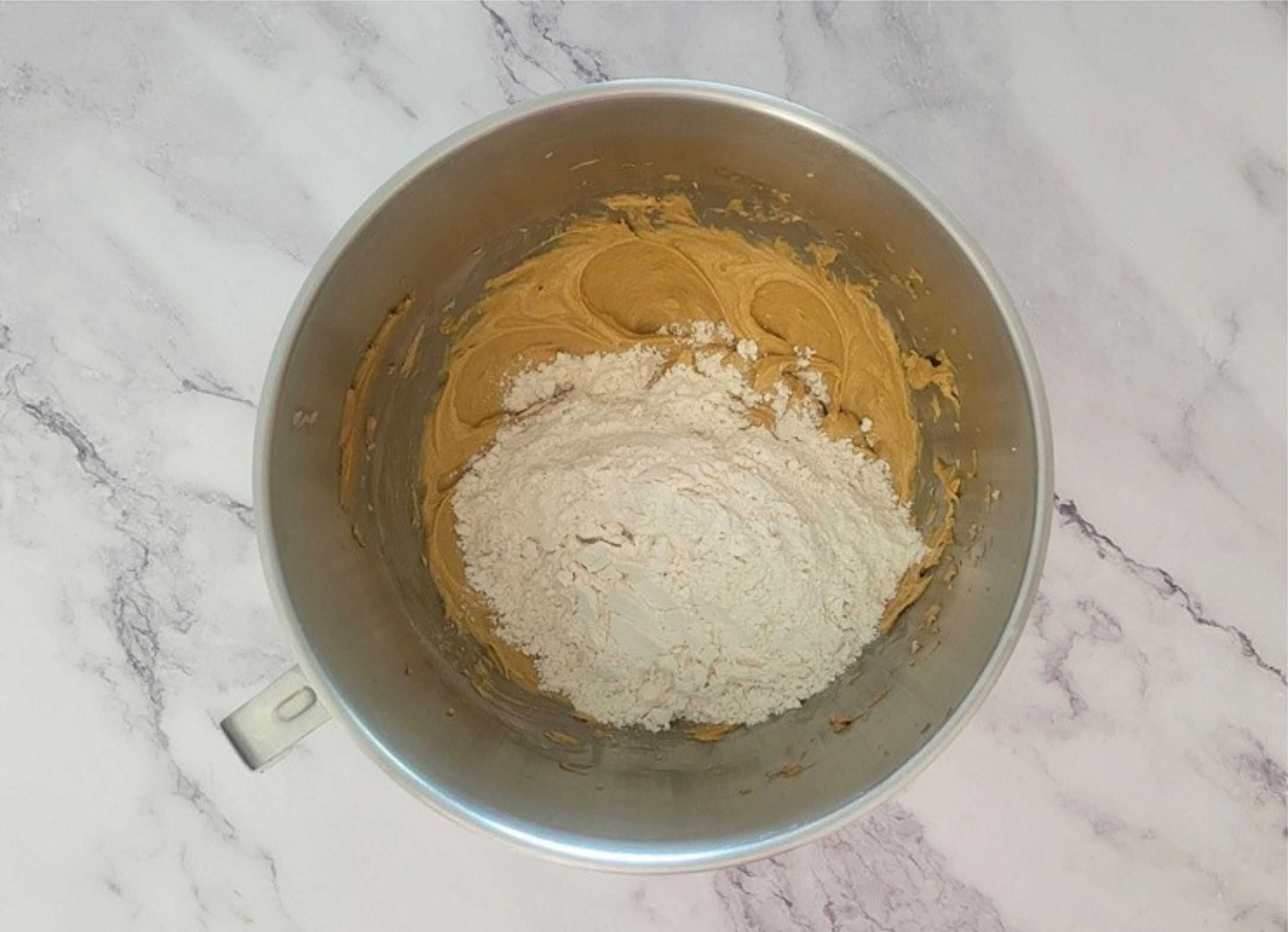 flour, baking soda and salt added to mixing bowl with other ingredients