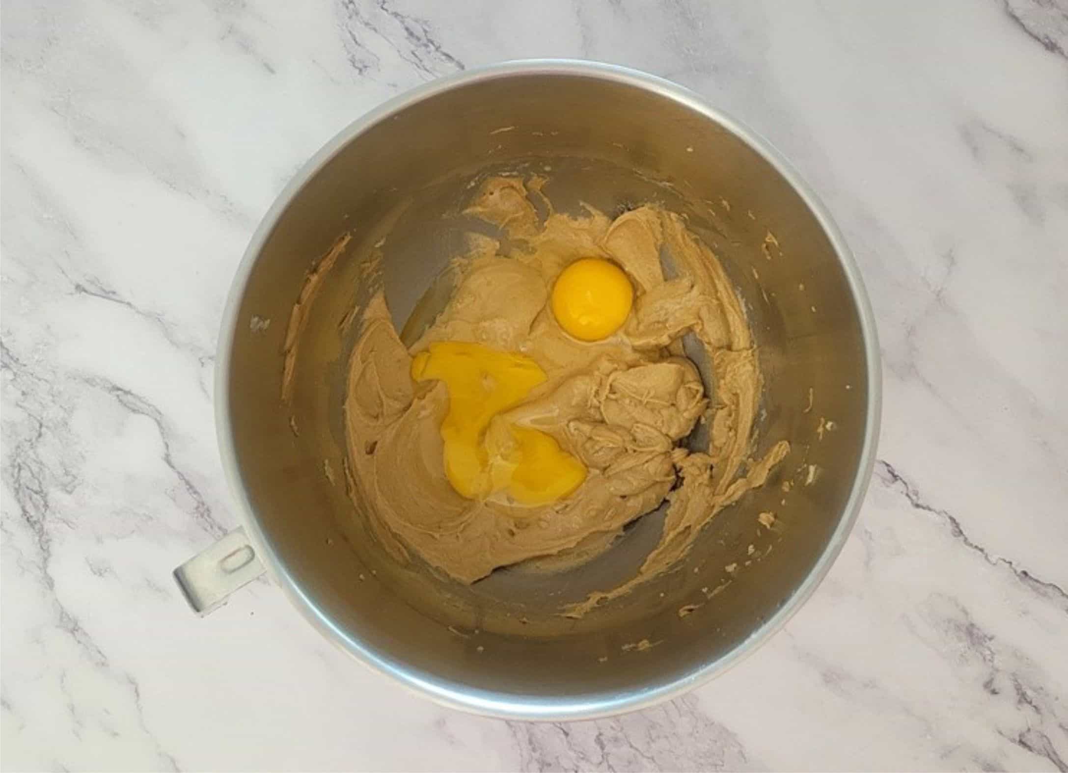 two eggs added to mixing bowl