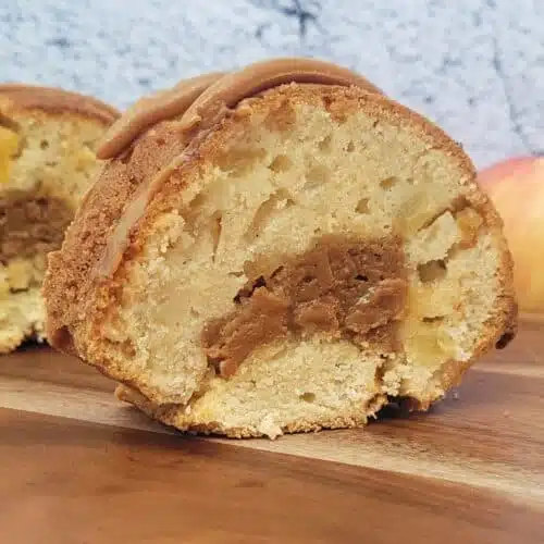 close up view of the inside of a slice of caramel apple cake