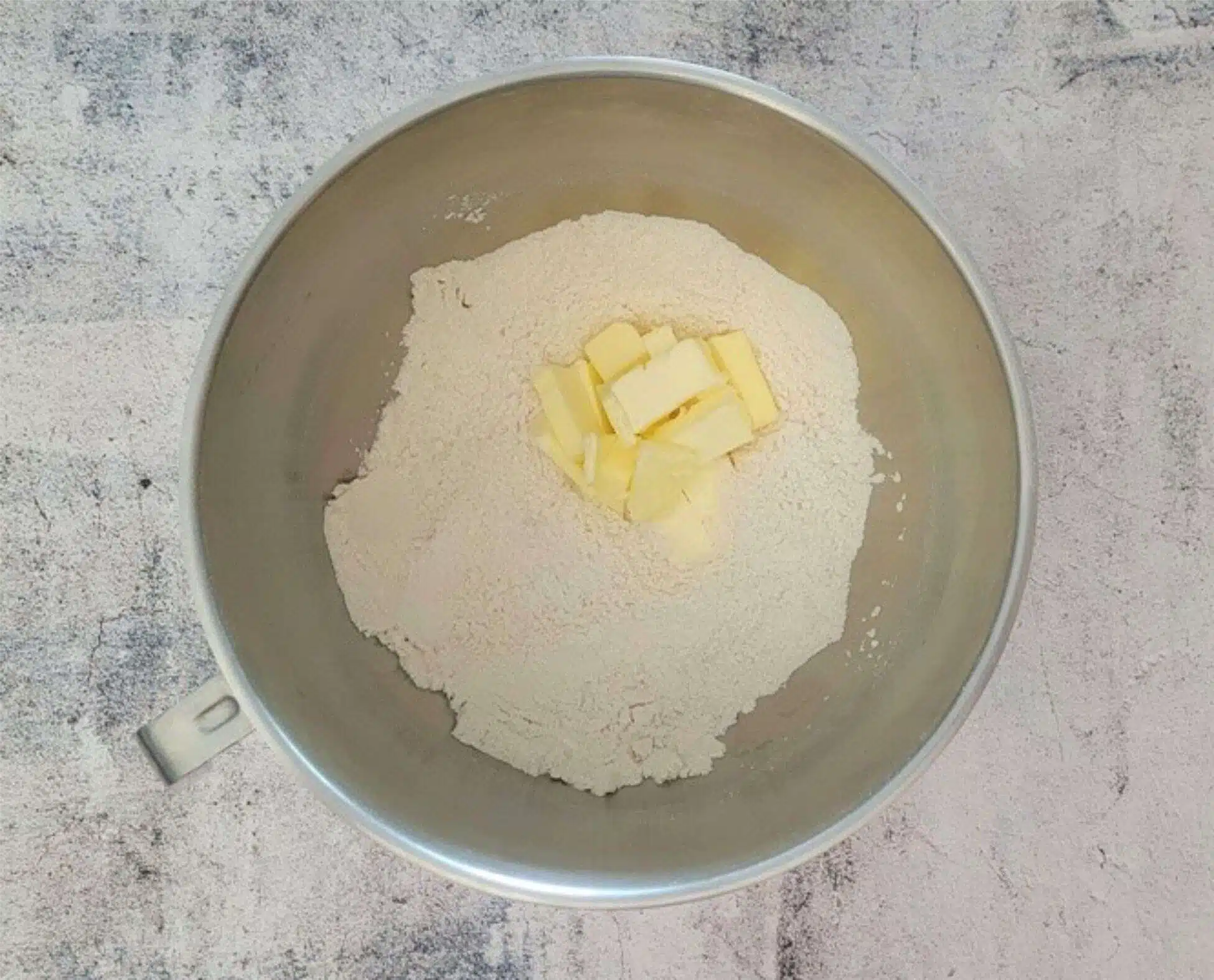 butter added to mixing bowl with dry ingredients