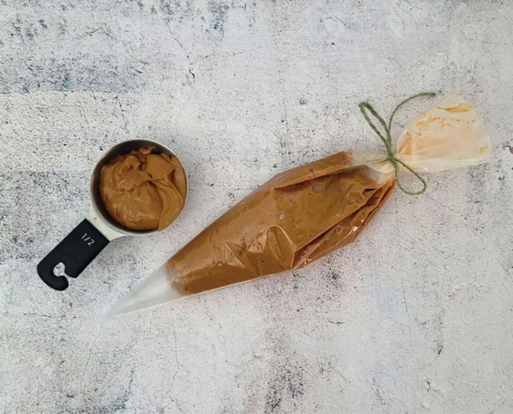 caramel added to a pastry bag and to a measuring cup