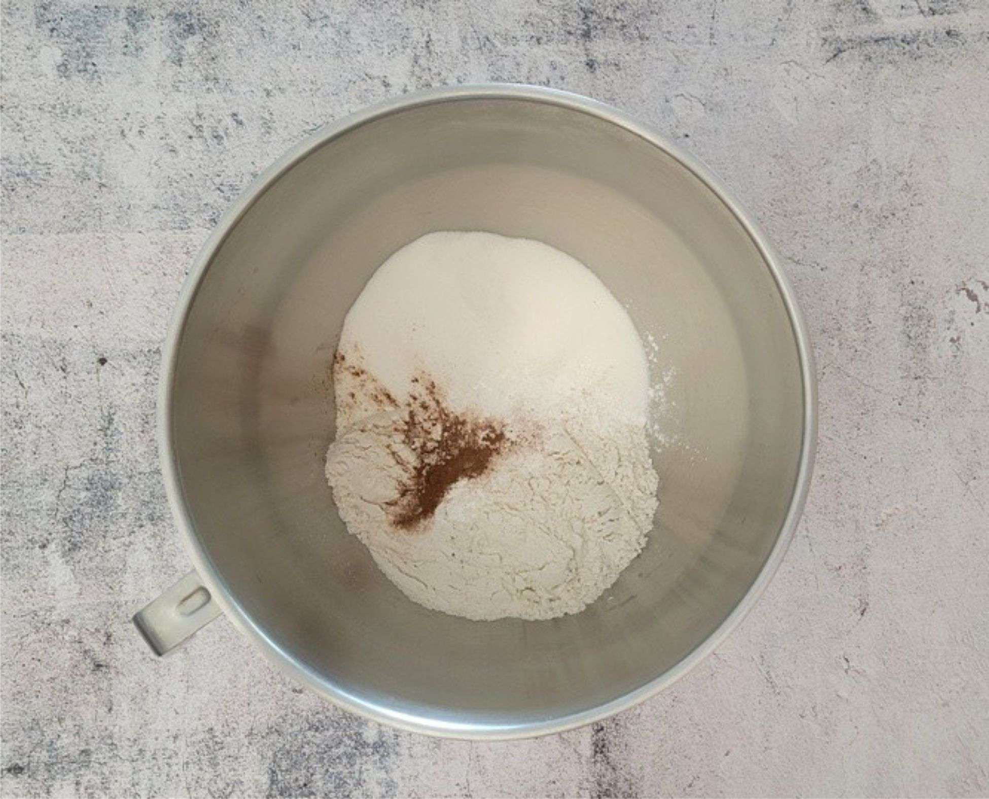 flour, sugar, cinnamon, baking powder and baking soda in a mixing bowl