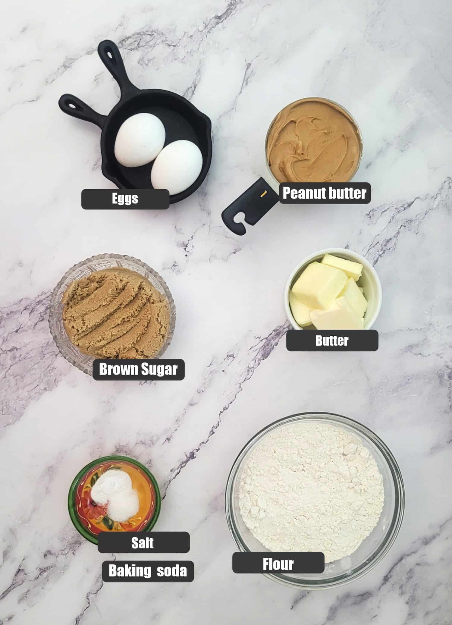 ingredients needed for peanut butter cookie dough including flour, salt, baking soda, brown sugar, butter, peanut butter and eggs