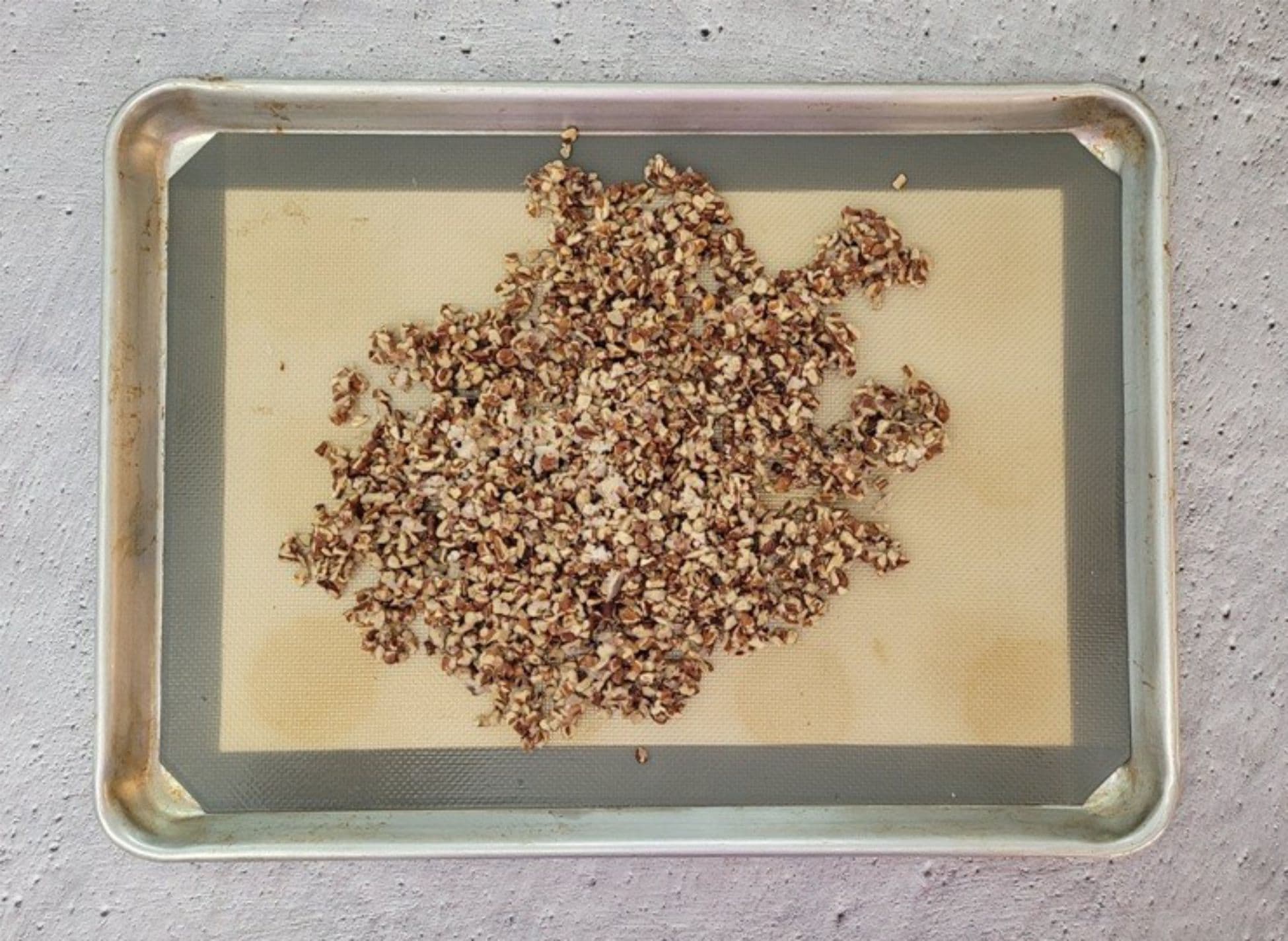 pecan praline cooling on a silicone mat