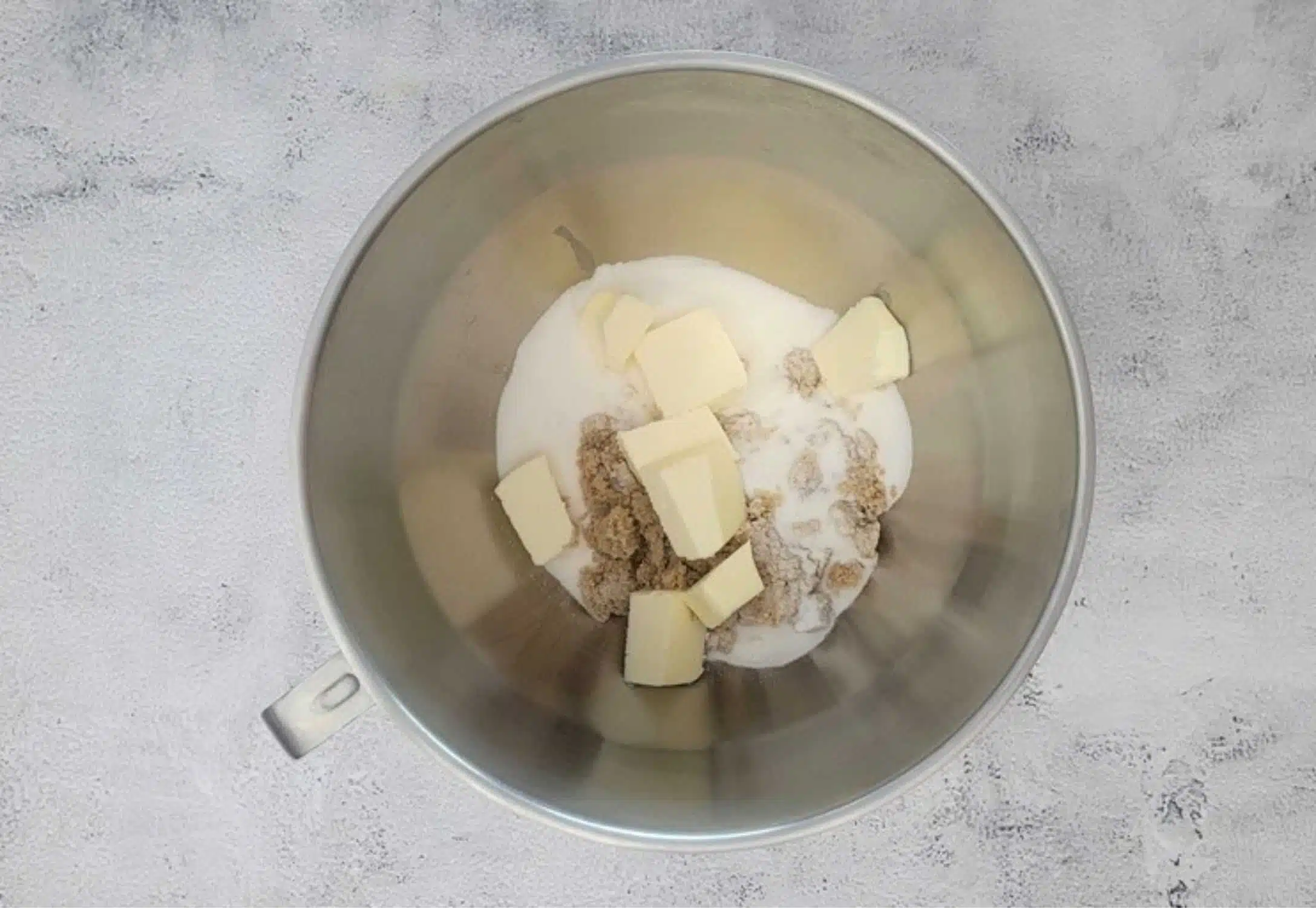 butter, granulated sugar and brown sugar added to mixing bowl