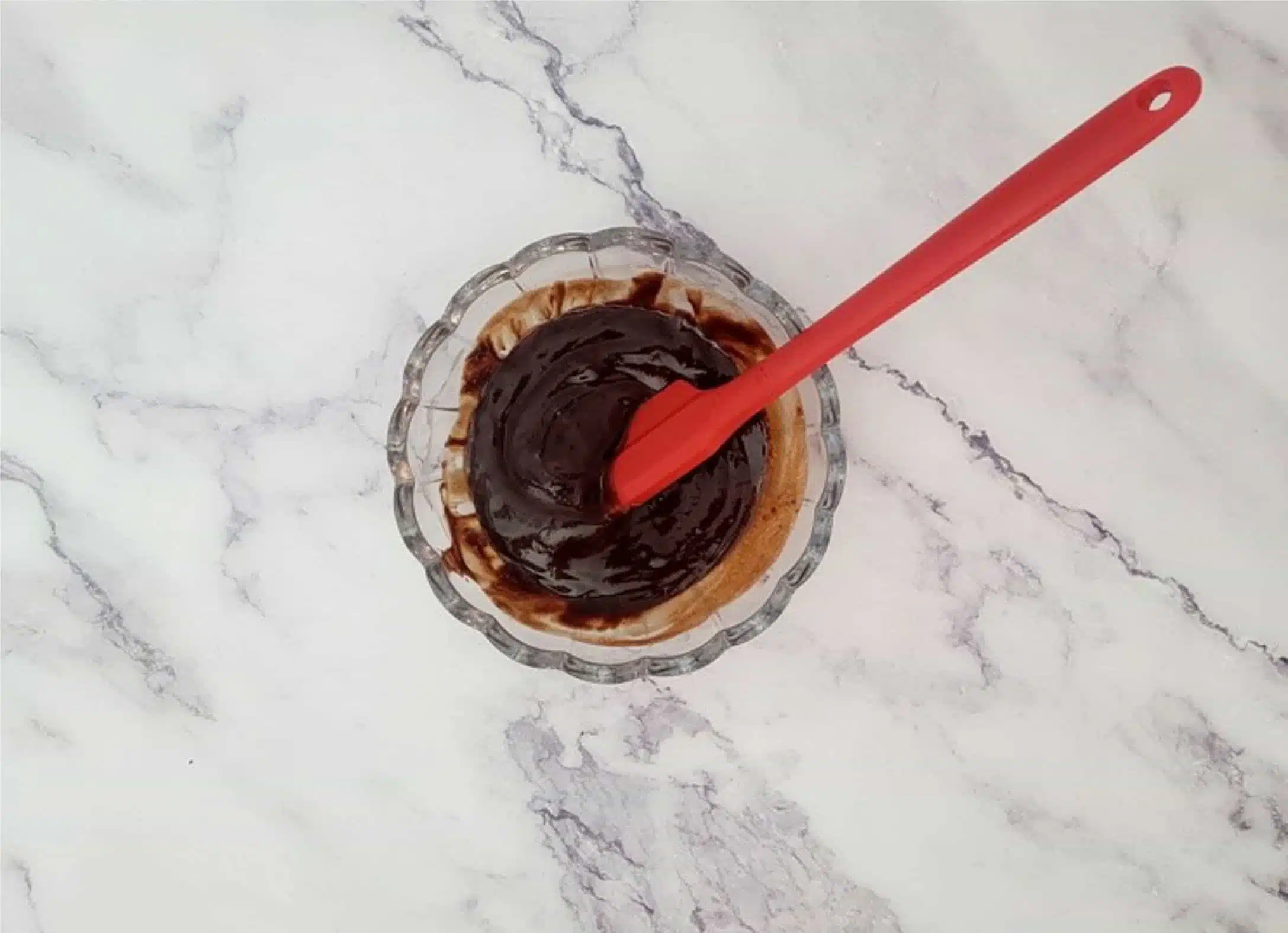 chocolate ganache in a glass bowl