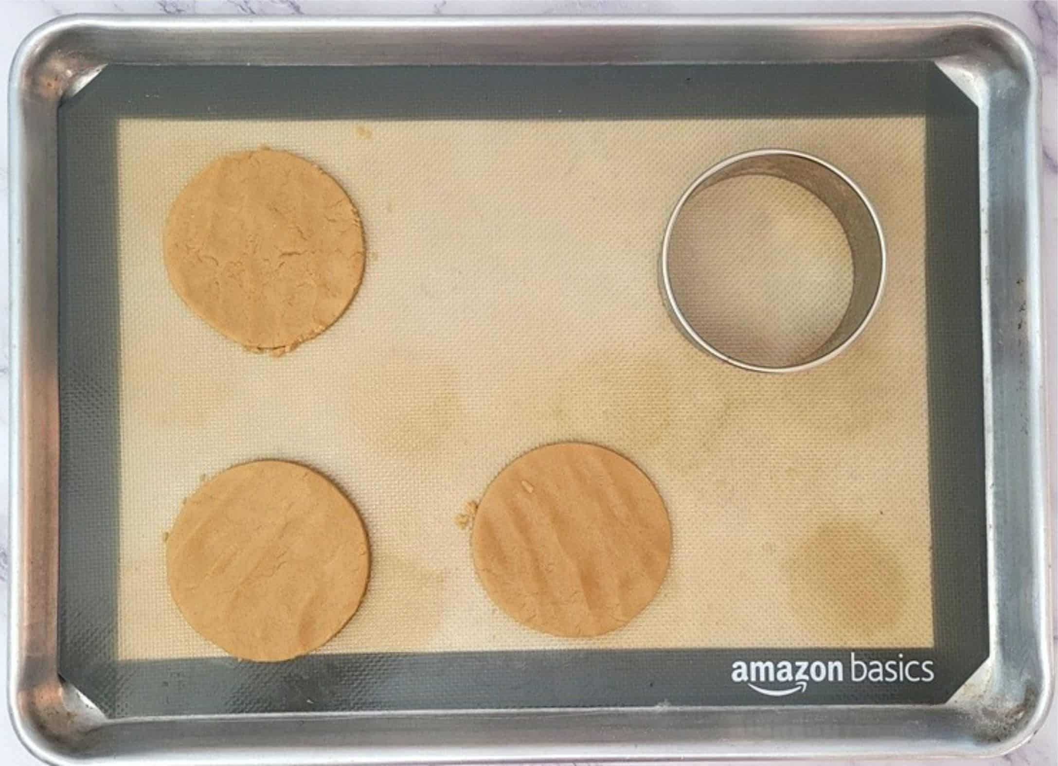 disks of peanut butter cookie dough on a sheet pan