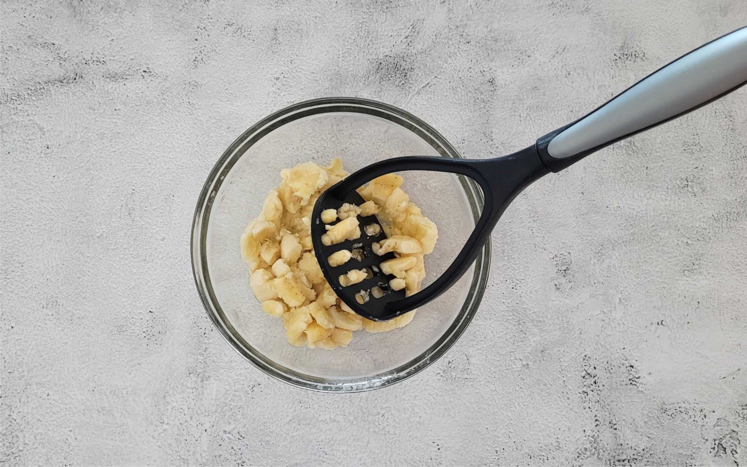 mash ripe bananas with a potato masher or fork