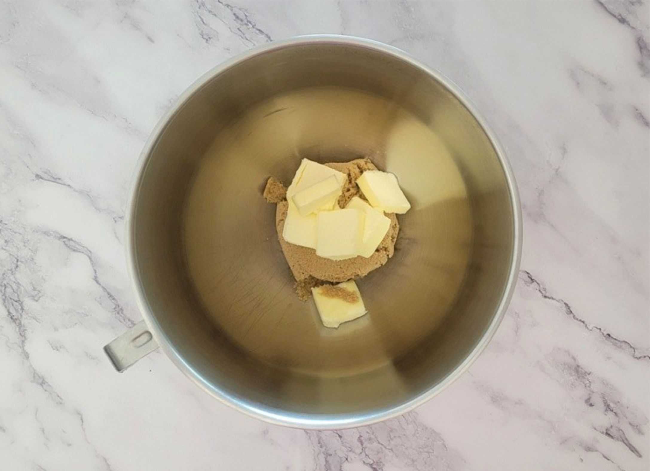 butter and brown sugar in a mixing bowl to begin making cookie dough