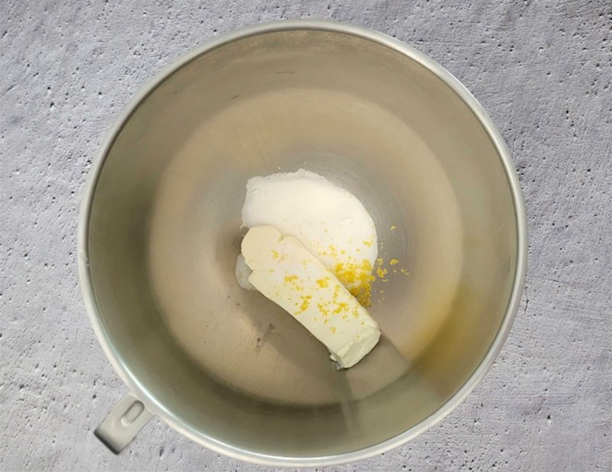 cream cheese, lemon zest, lemon juice and granulated sugar in a mixing bowl