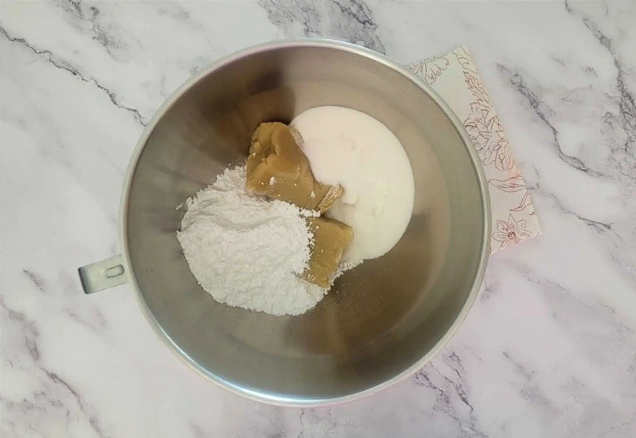 almond paste and confectioners sugar and granulated sugar in a mixing bowl