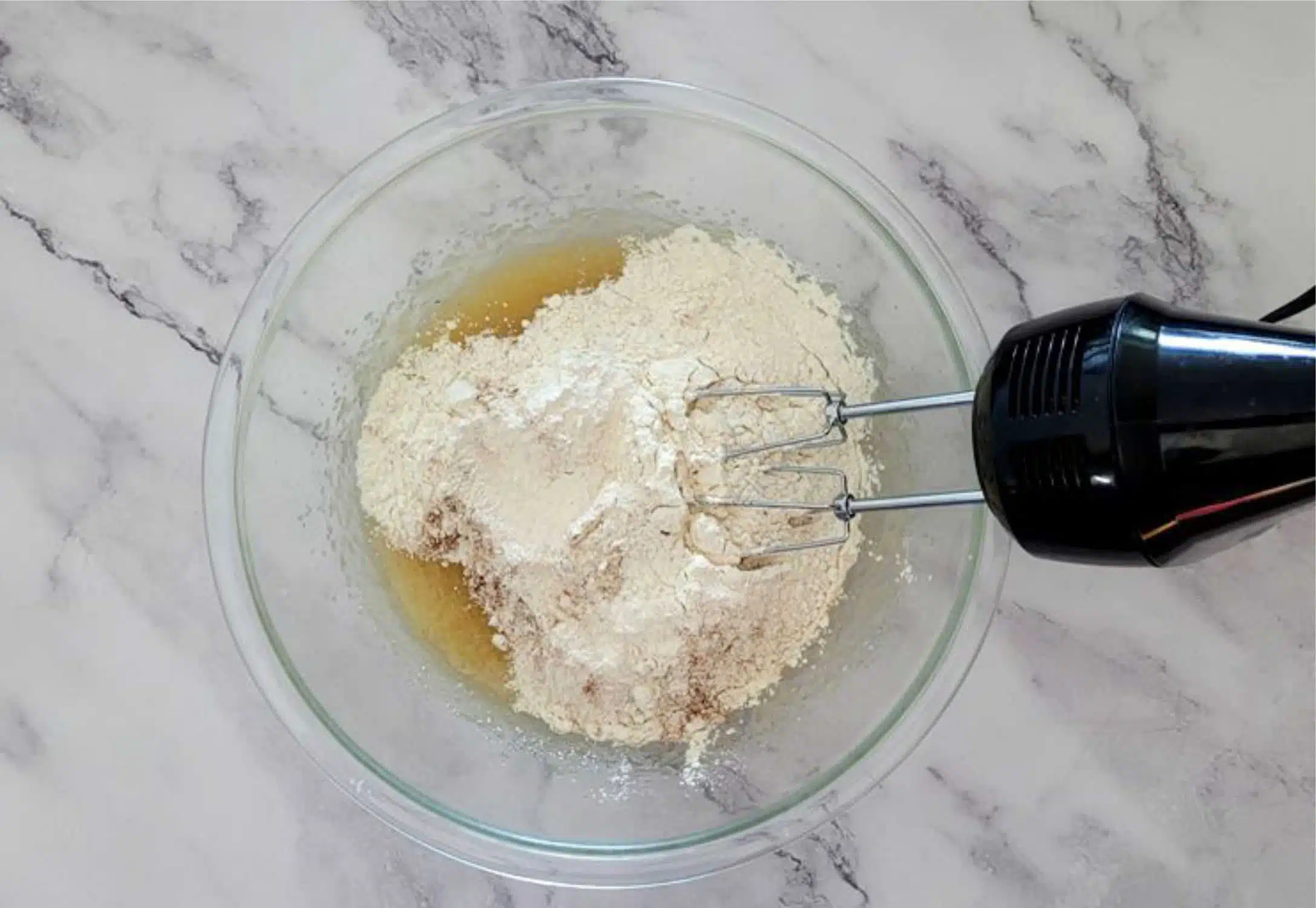 dry ingredients added to mixing bowl to make cake batter