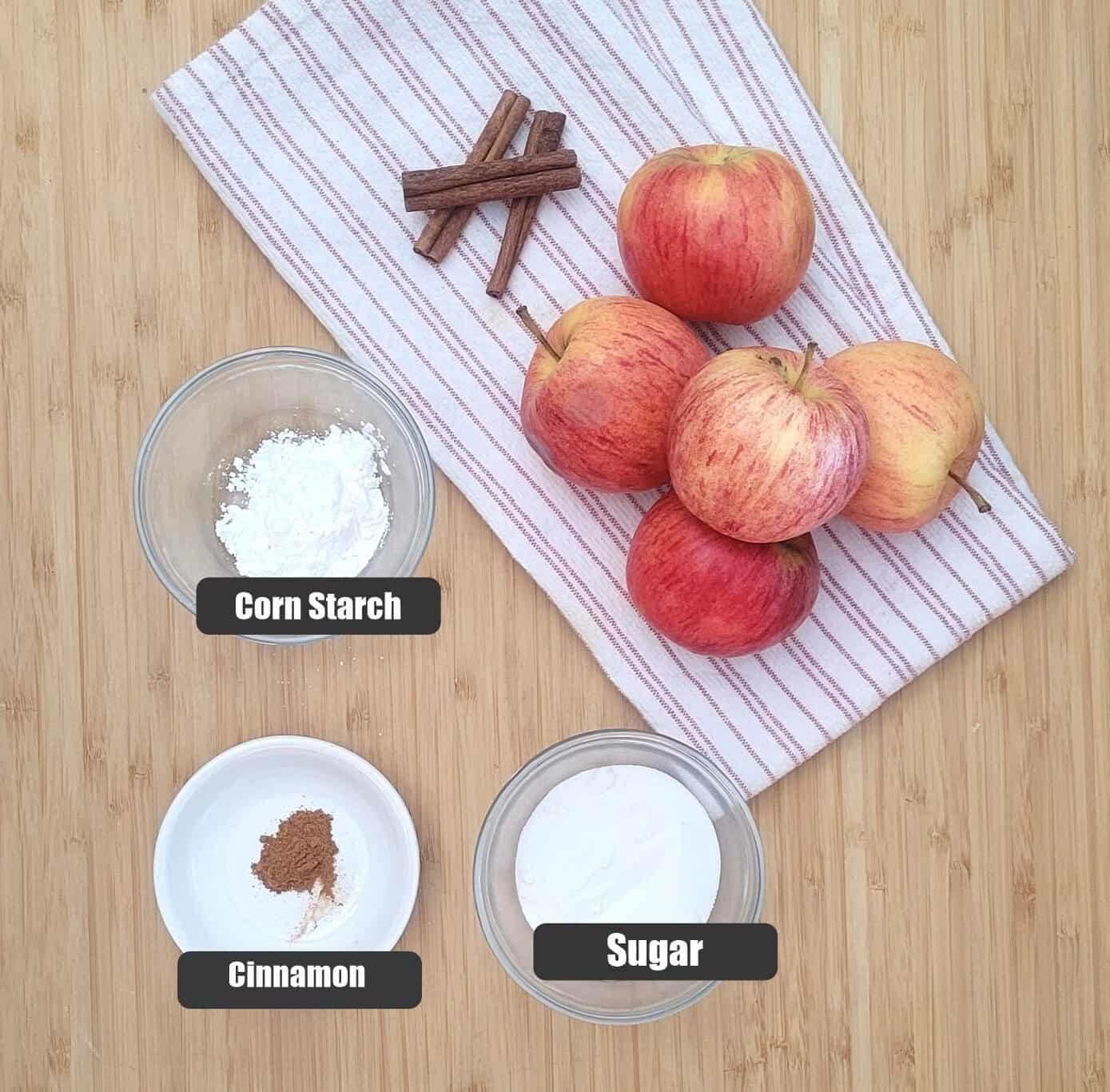 ingredients needed for cookie bar filling including apples, cornstarch, cinnamon and sugar