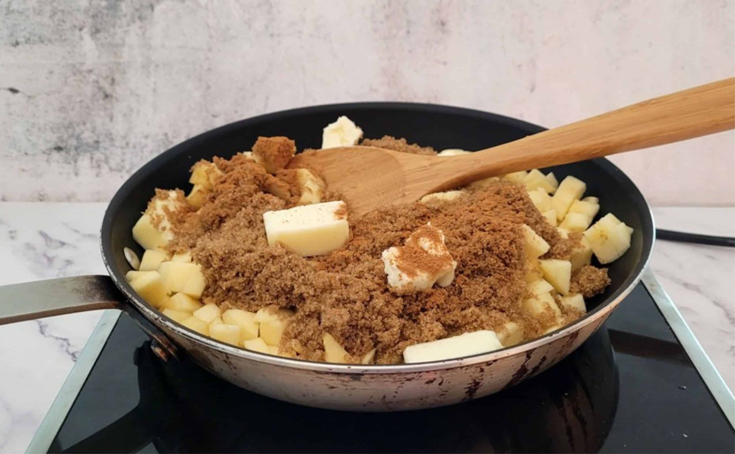 heating apple chunks, butter, cinnamon and brown sugar in a saucepan