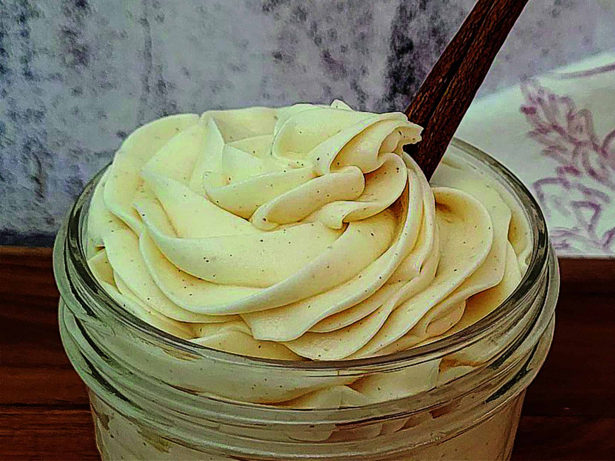 mason jar with frosting piped in swirls