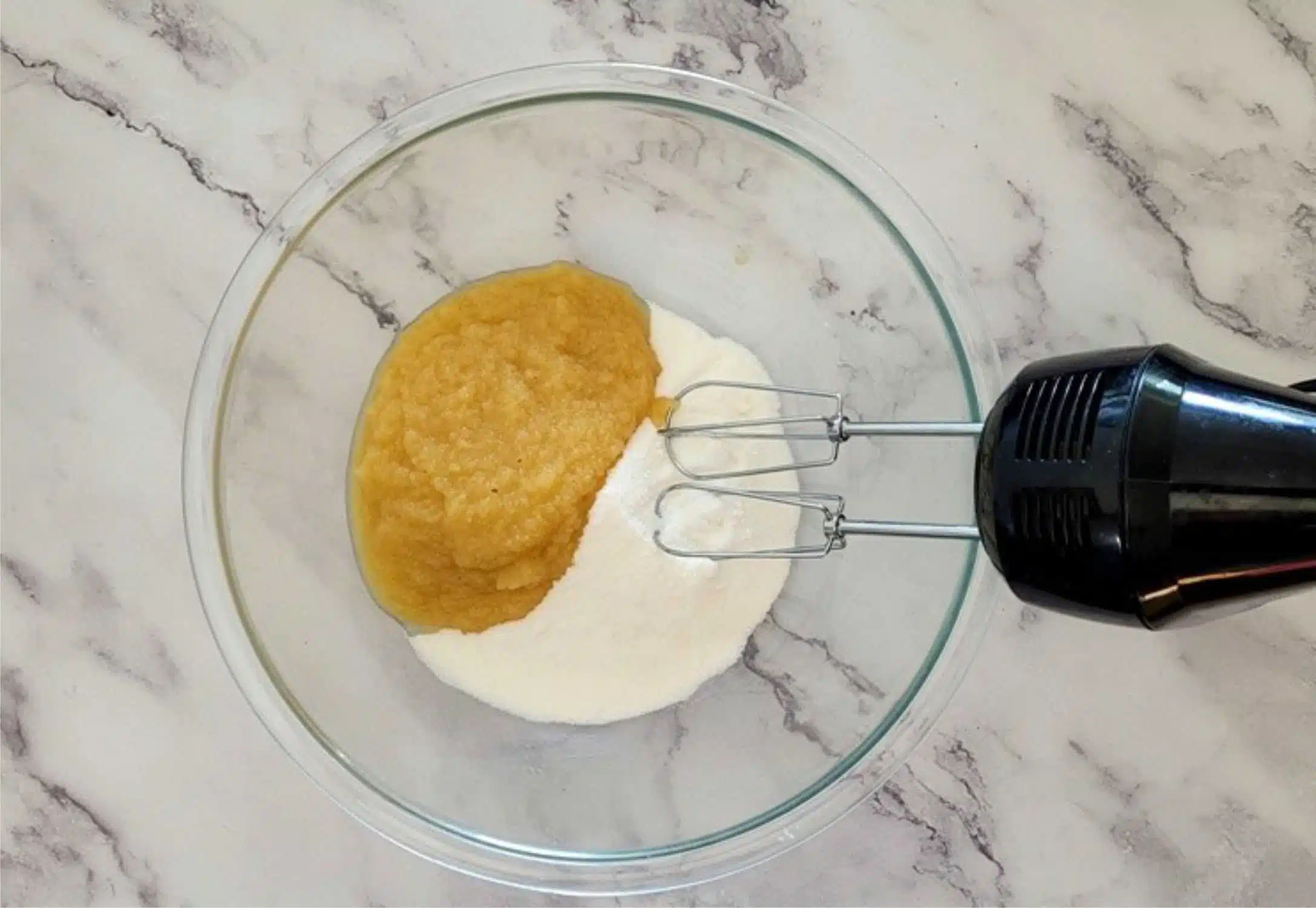 applesauce and granulated sugar in a mixing bowl