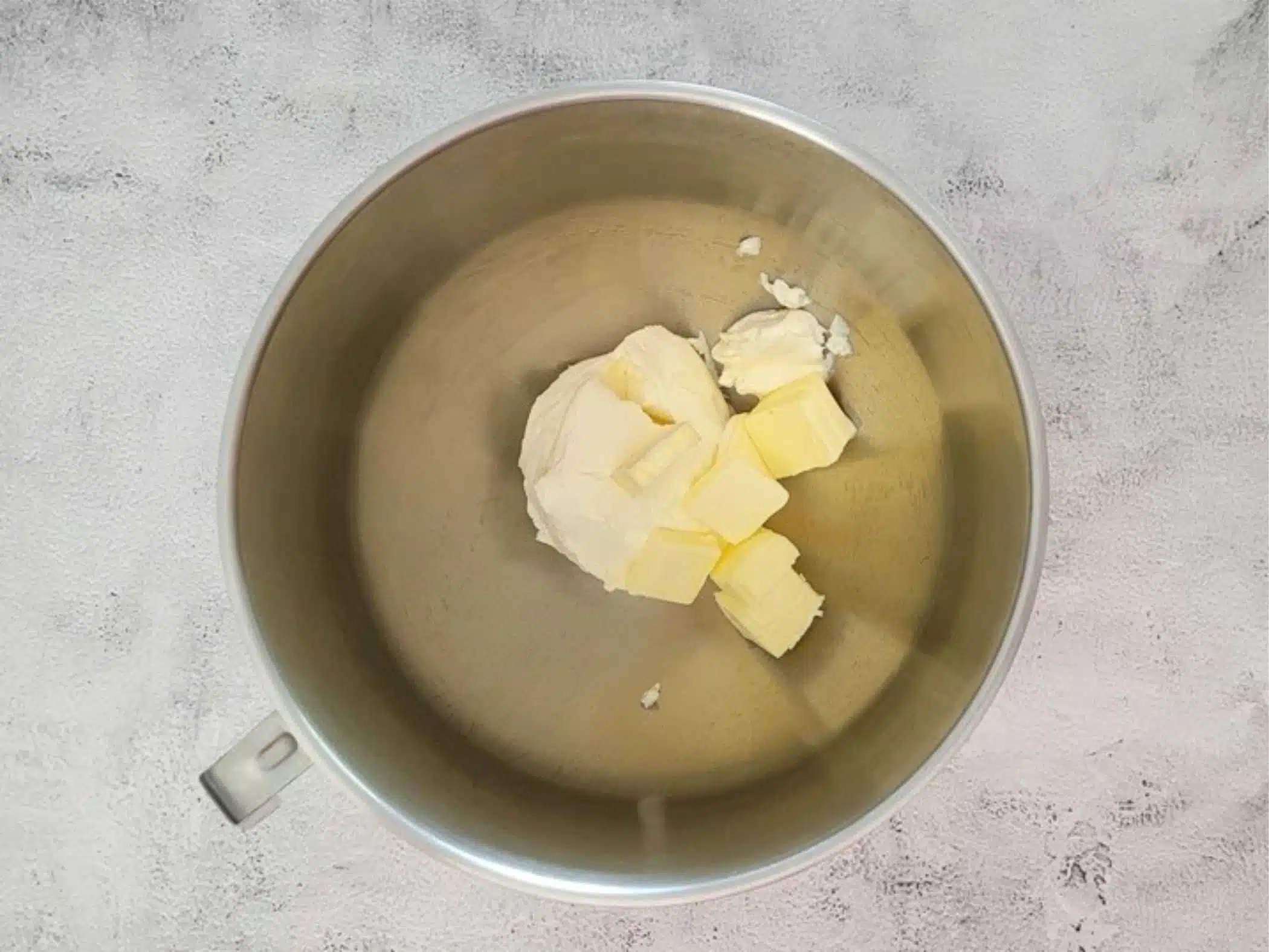 cream cheese and butter in a mixing bowl