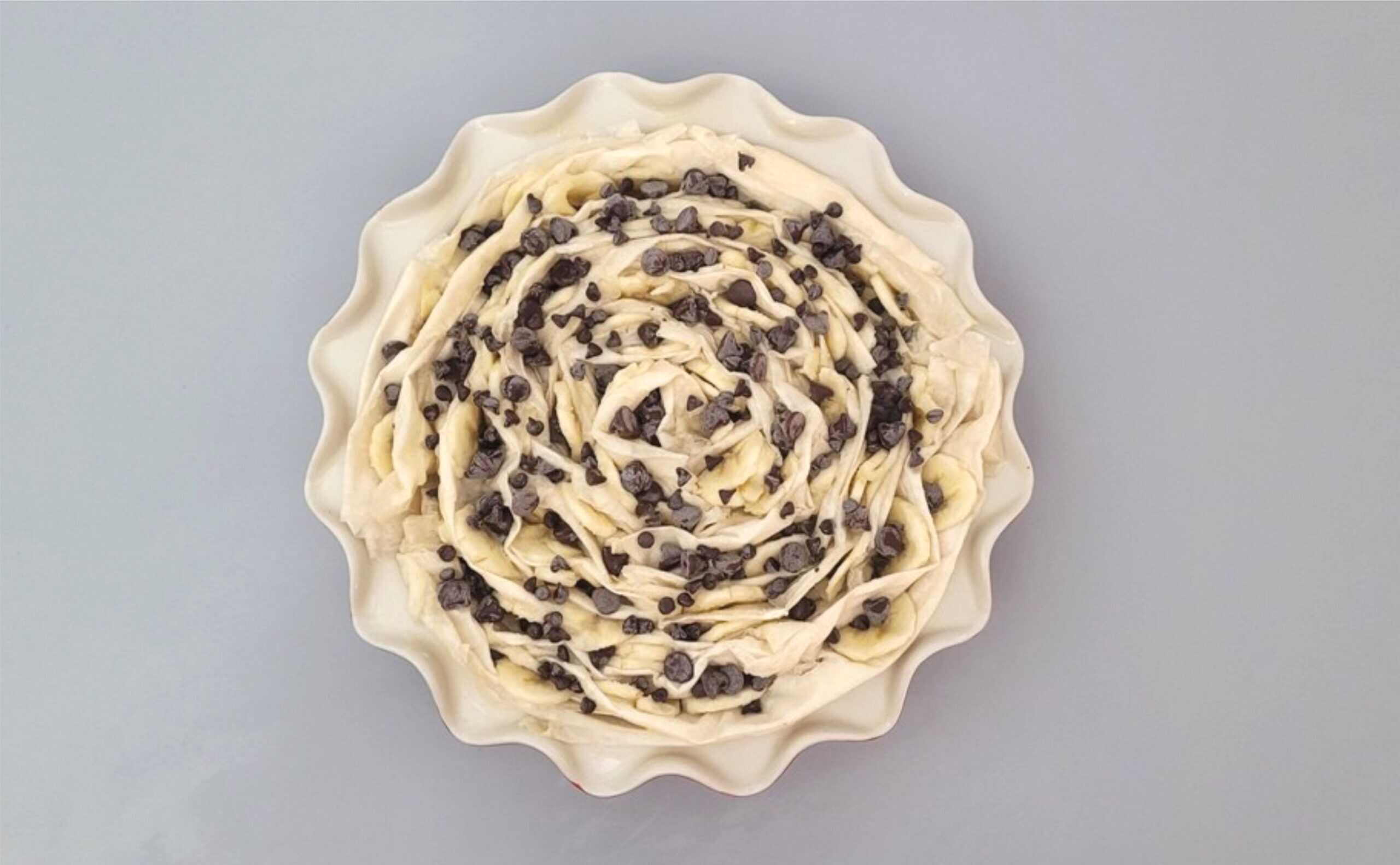 banana slices and chocolate added between folds of phyllo