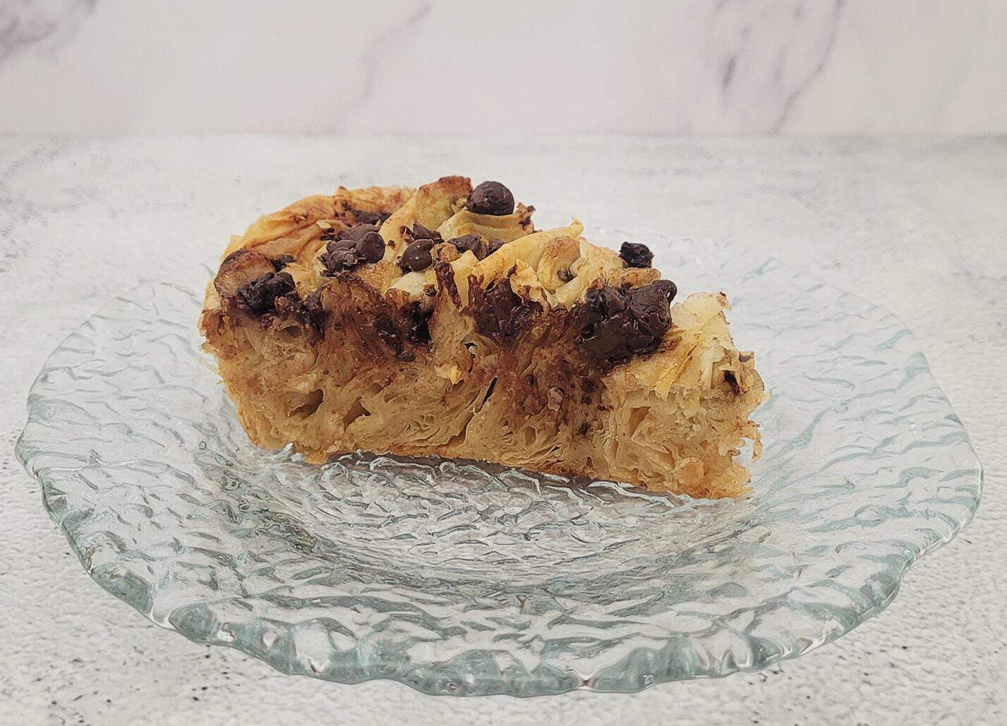 one slice of crinkle pie on a glass plate