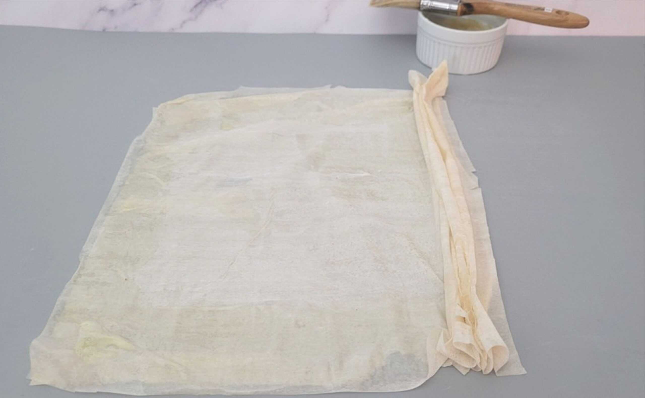 phyllo dough being folding in accordion folds