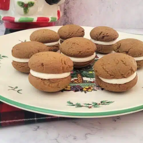 gingerbread whoopie pie on a serving dish and a Santa cookie jar in the background