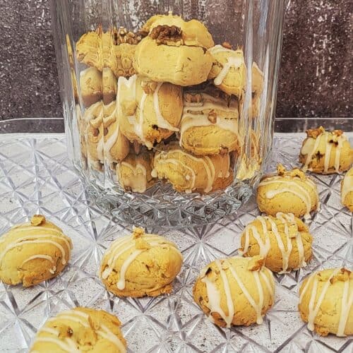 maple walnut cookies on a serving tray and some cookies in a cookie jar