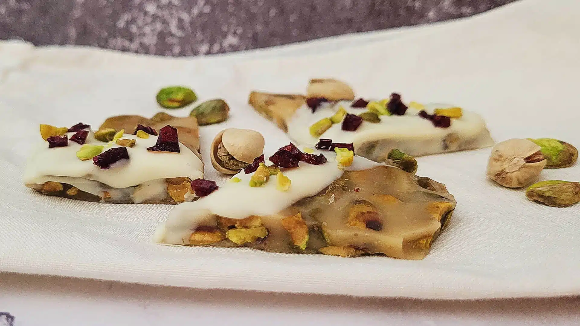 variation of pistachio brittle dipped in white chocolate