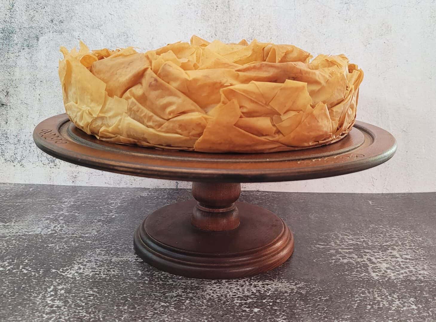 finished pumpkin pie baklava on a wooden cake stand