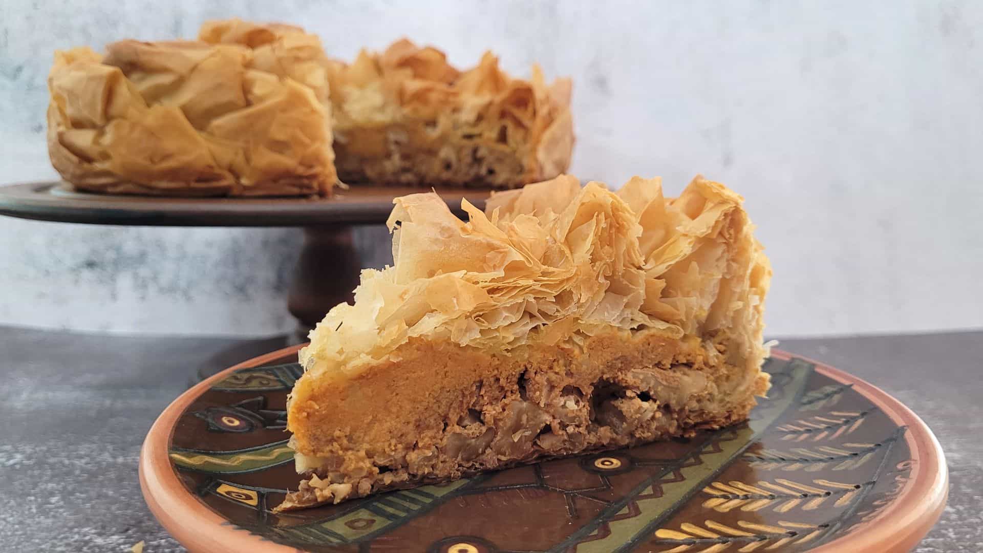 slice of pumpkin pie baklava with remainder of dessert in the background