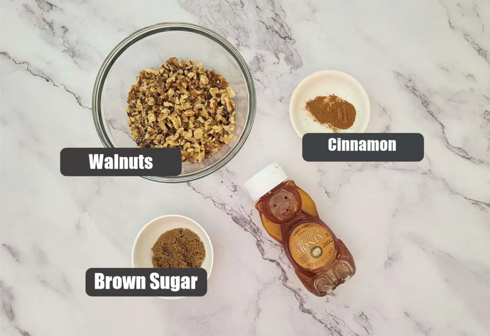 Ingredients needed for walnut filling including brown sugar, walnuts, honey and cinnamon