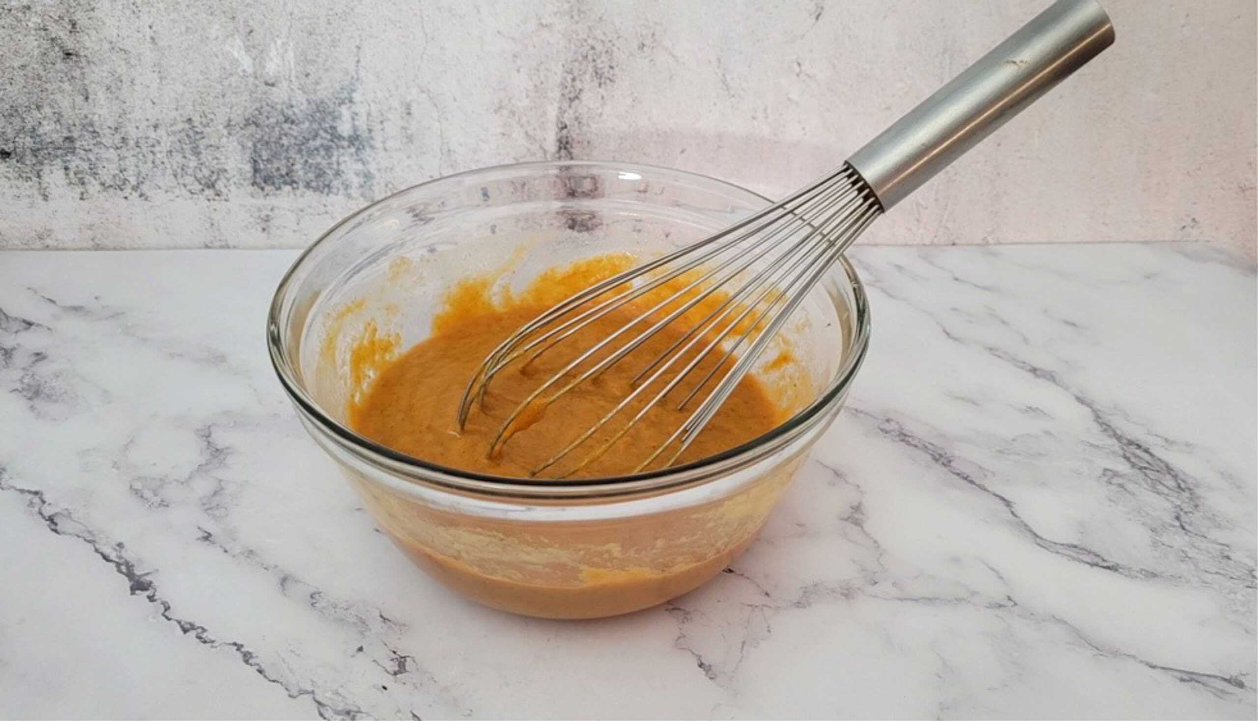 bowl with pumpkin filling whisked together