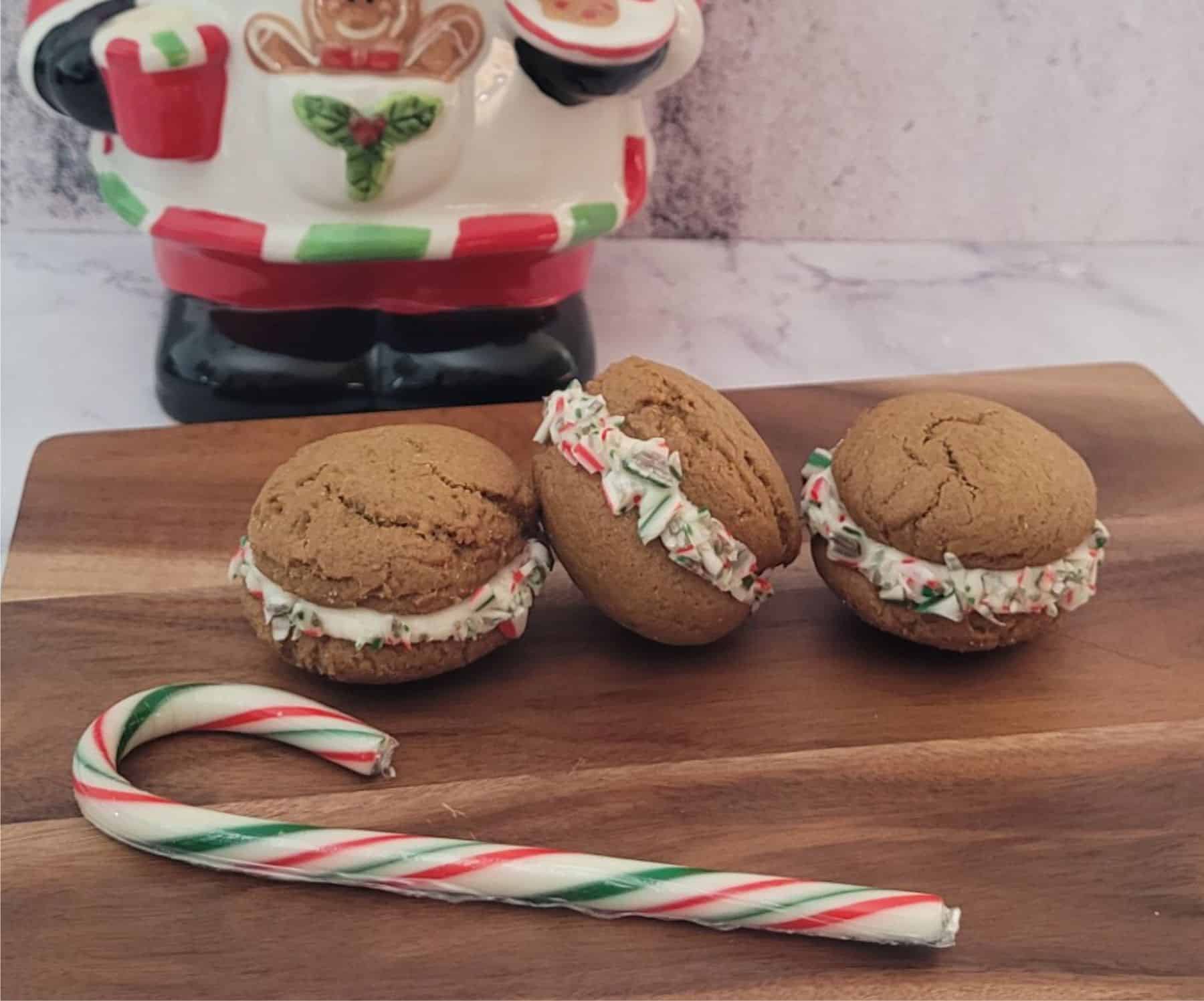 gingerbread whoopie pies with filling rolled in crushed candy canes