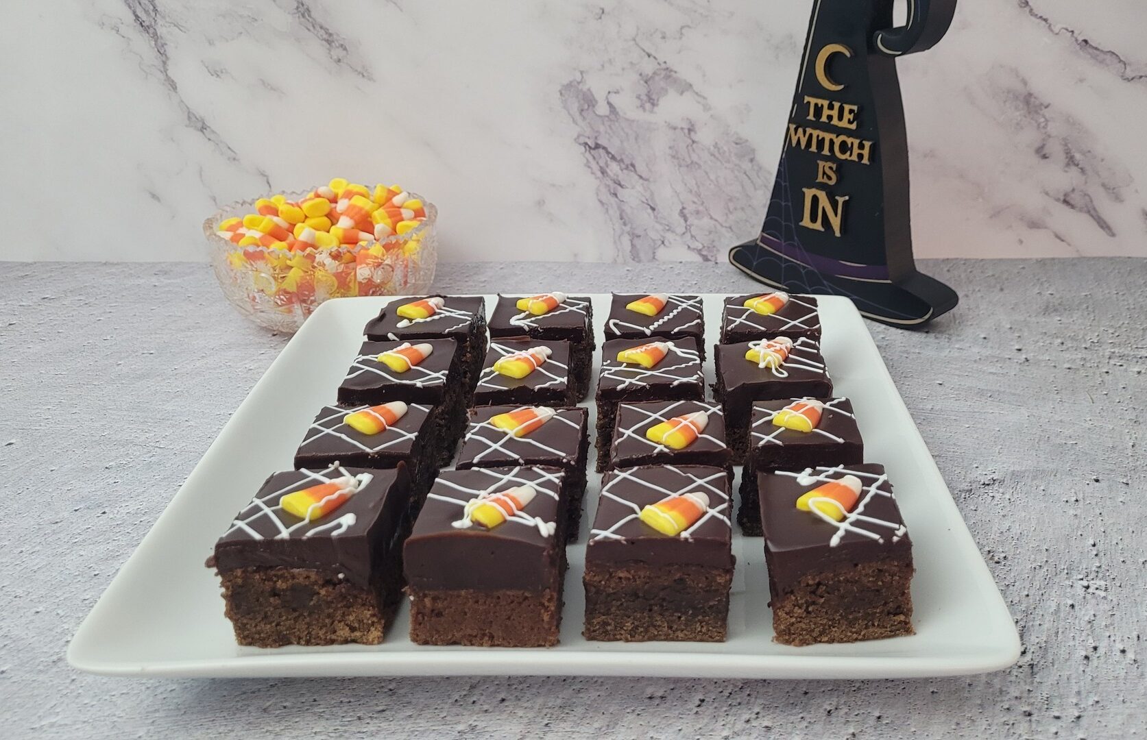 pieces of Halloween candy corn brownies on a platter