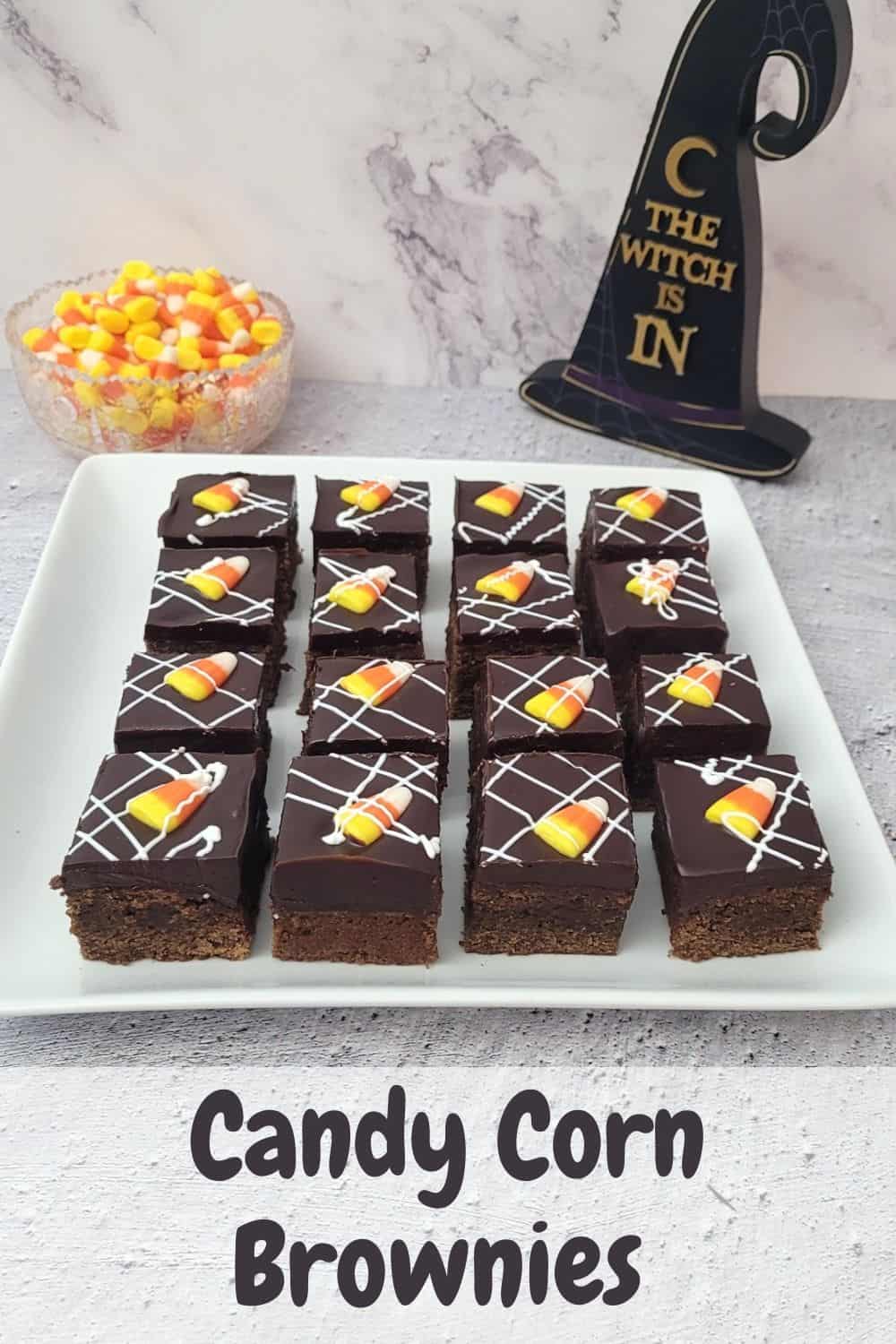 Halloween candy corn brownies cut into pieces and name of recipe typed on photo