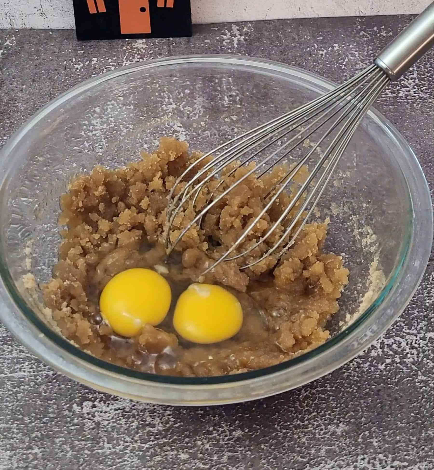 two eggs added to mixing bowl