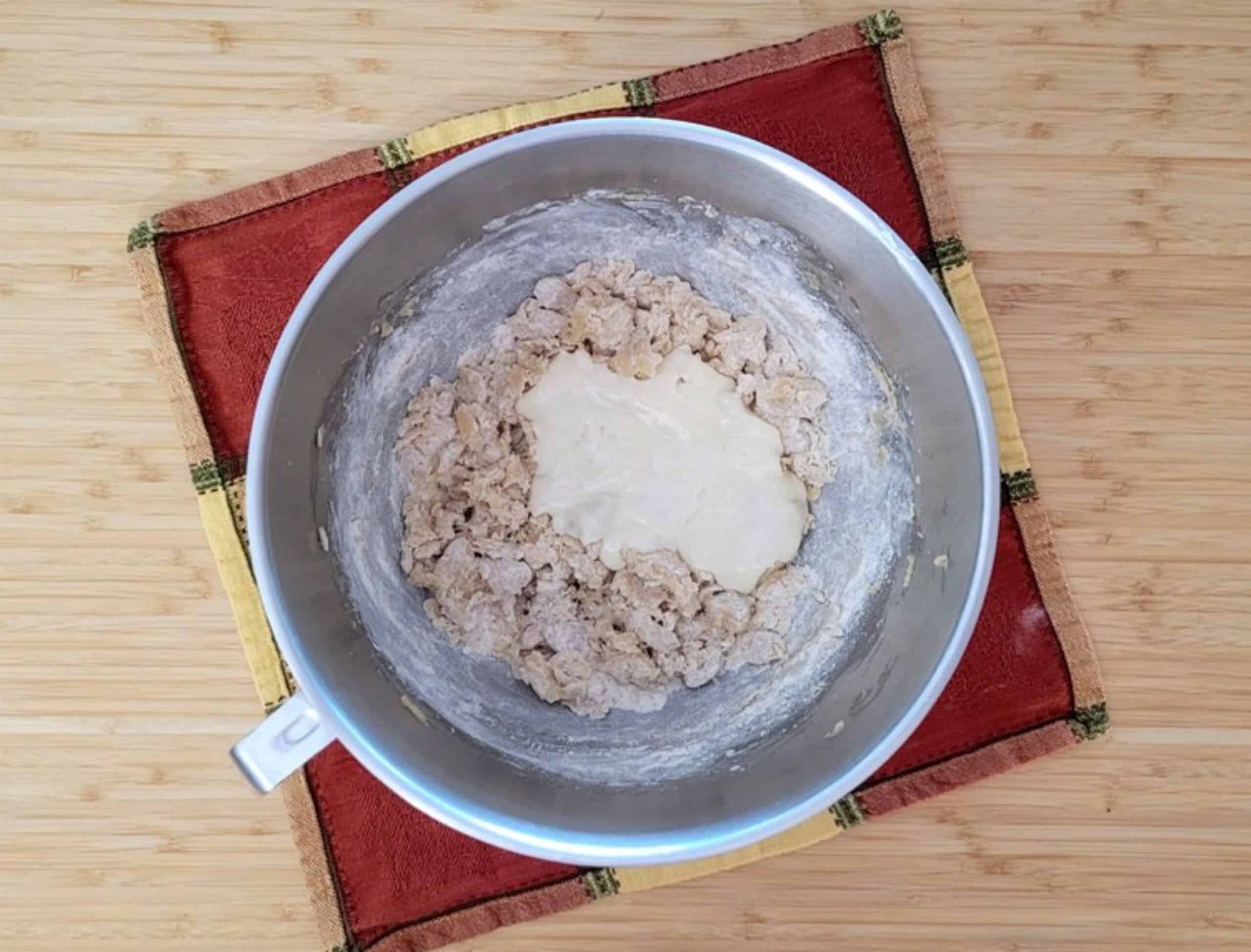 maple syrup and sour cream added to mixing bowl