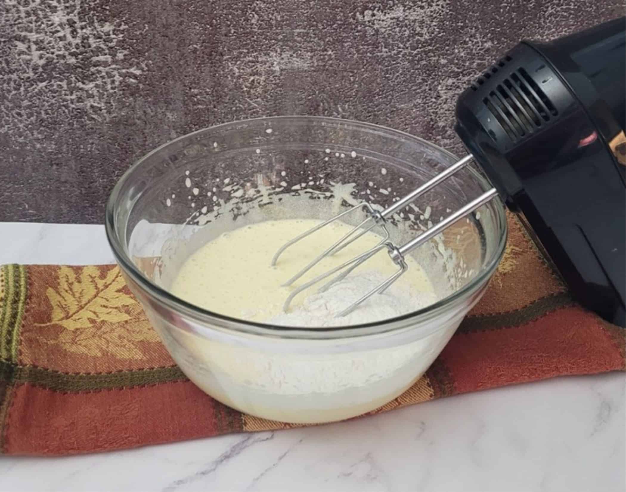 first measure of dry ingredients added to mixing bowl to make pumpkin mousse cake recipe