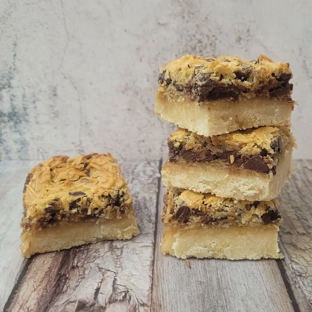 stack of cookie bars on a wooden countertop