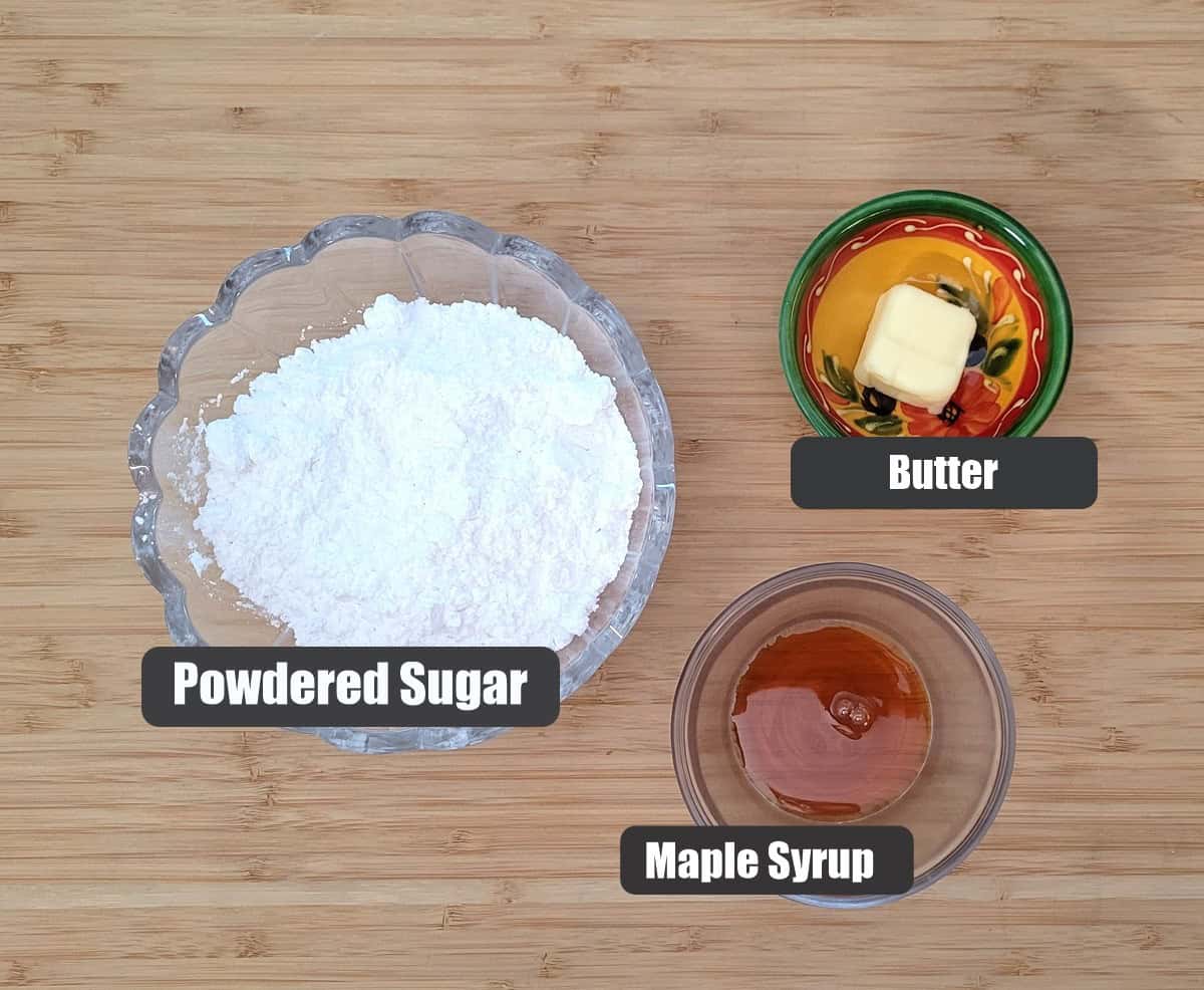 ingredients needed for cake glaze including powdered sugar, butter and maple syrup