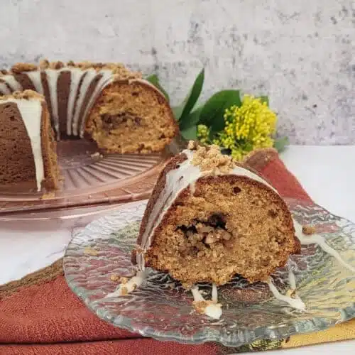 closeup of a slice of maple cake with pecan streusel filling