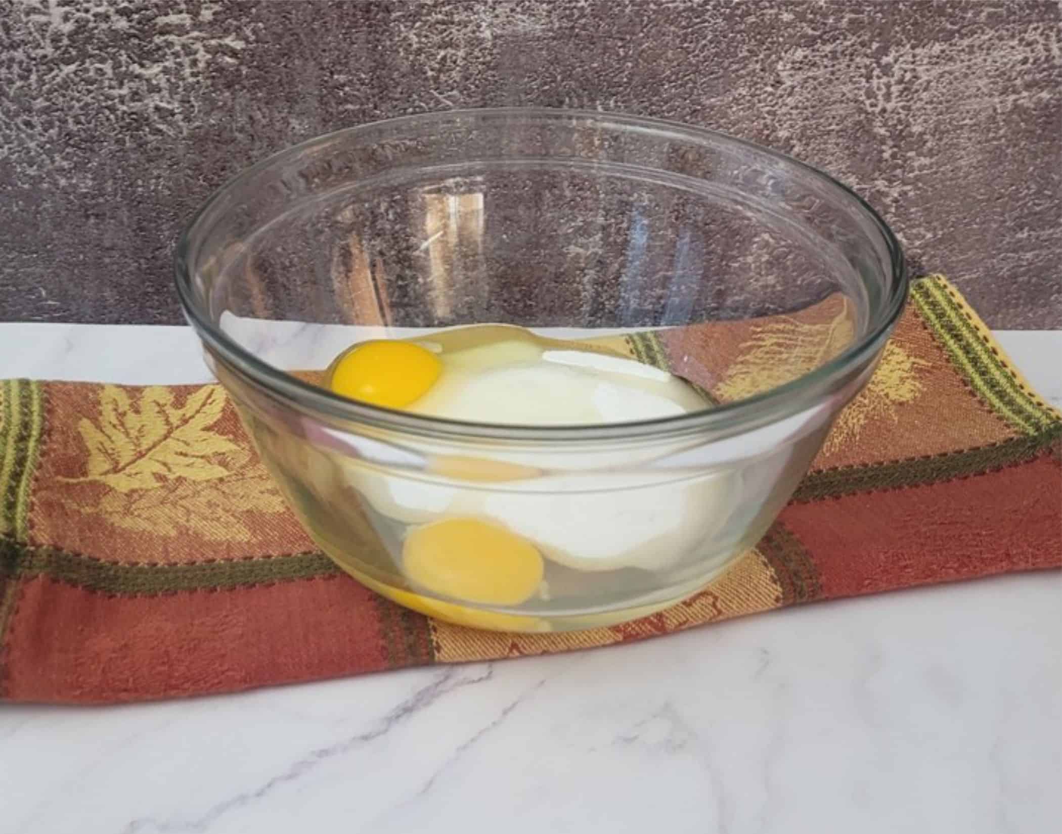 eggs and granulated sugar in a mixing bowl to make spice cake for pumpkin mousse cake recipe