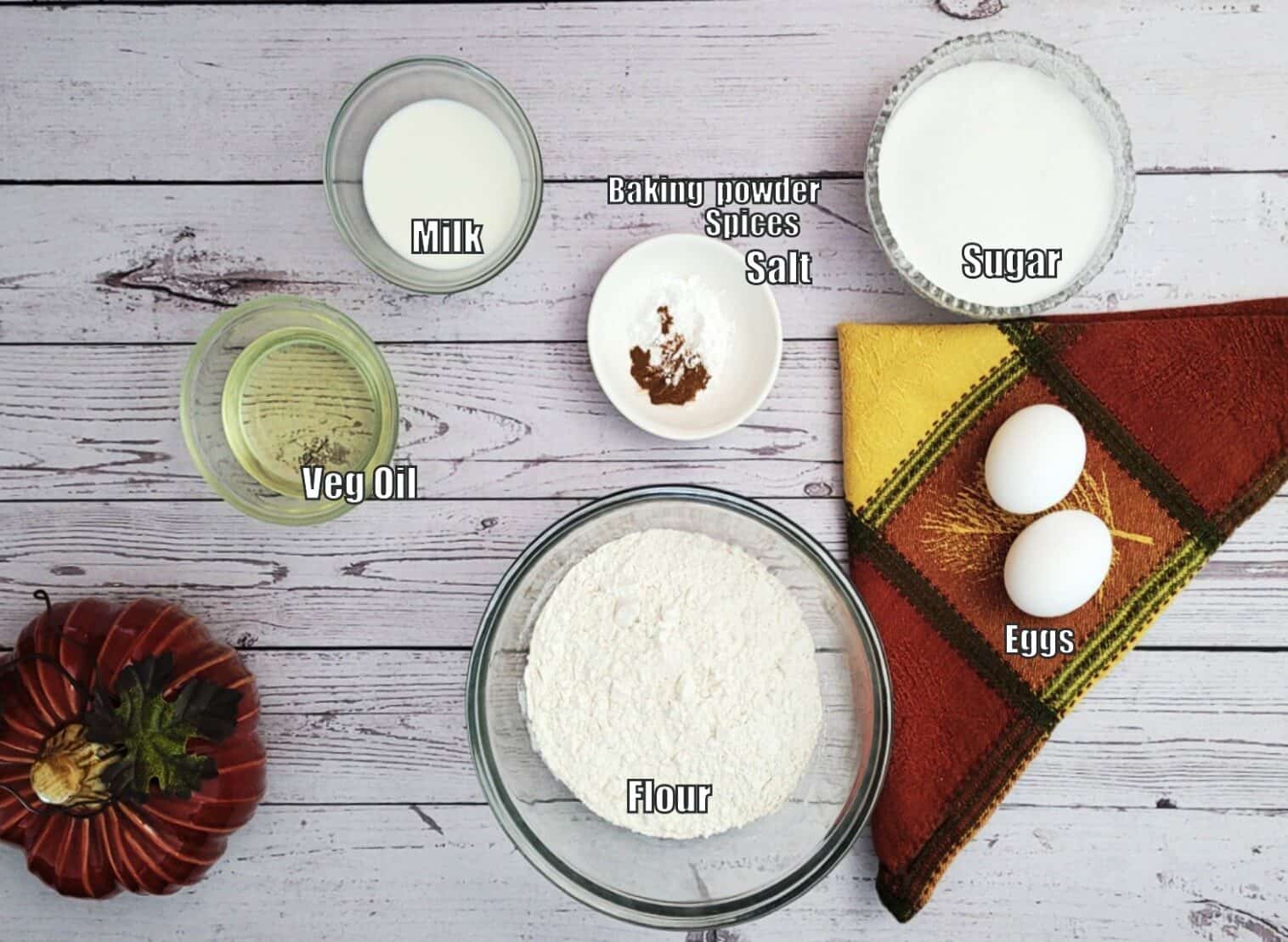 ingredients needed for spice cake including flour, eggs, sugar, vegetable oil, milk, baking powder, spices and salt