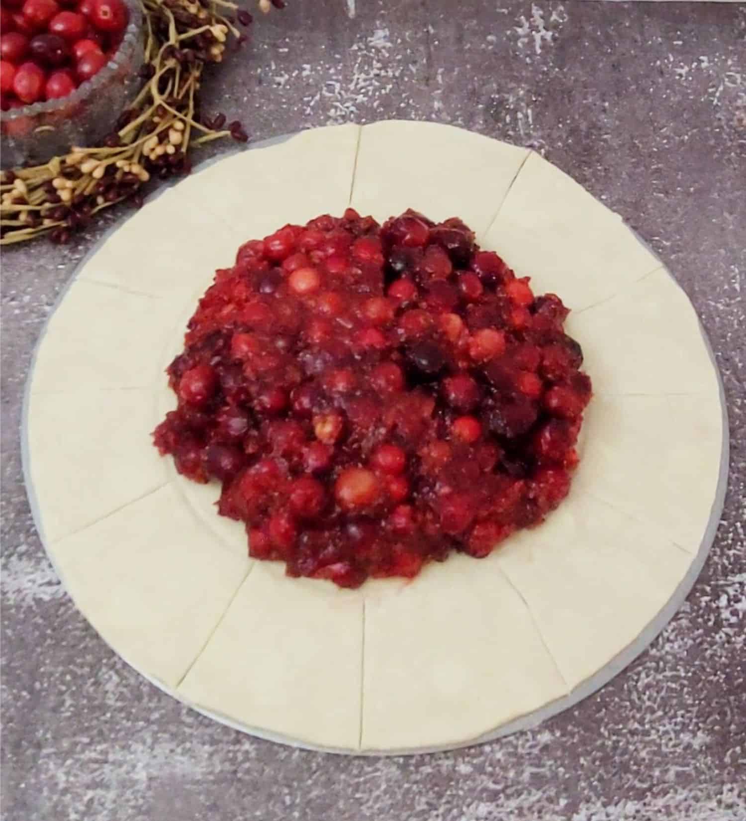 filling placed in middle of puff pastry circle to make cranberry galette