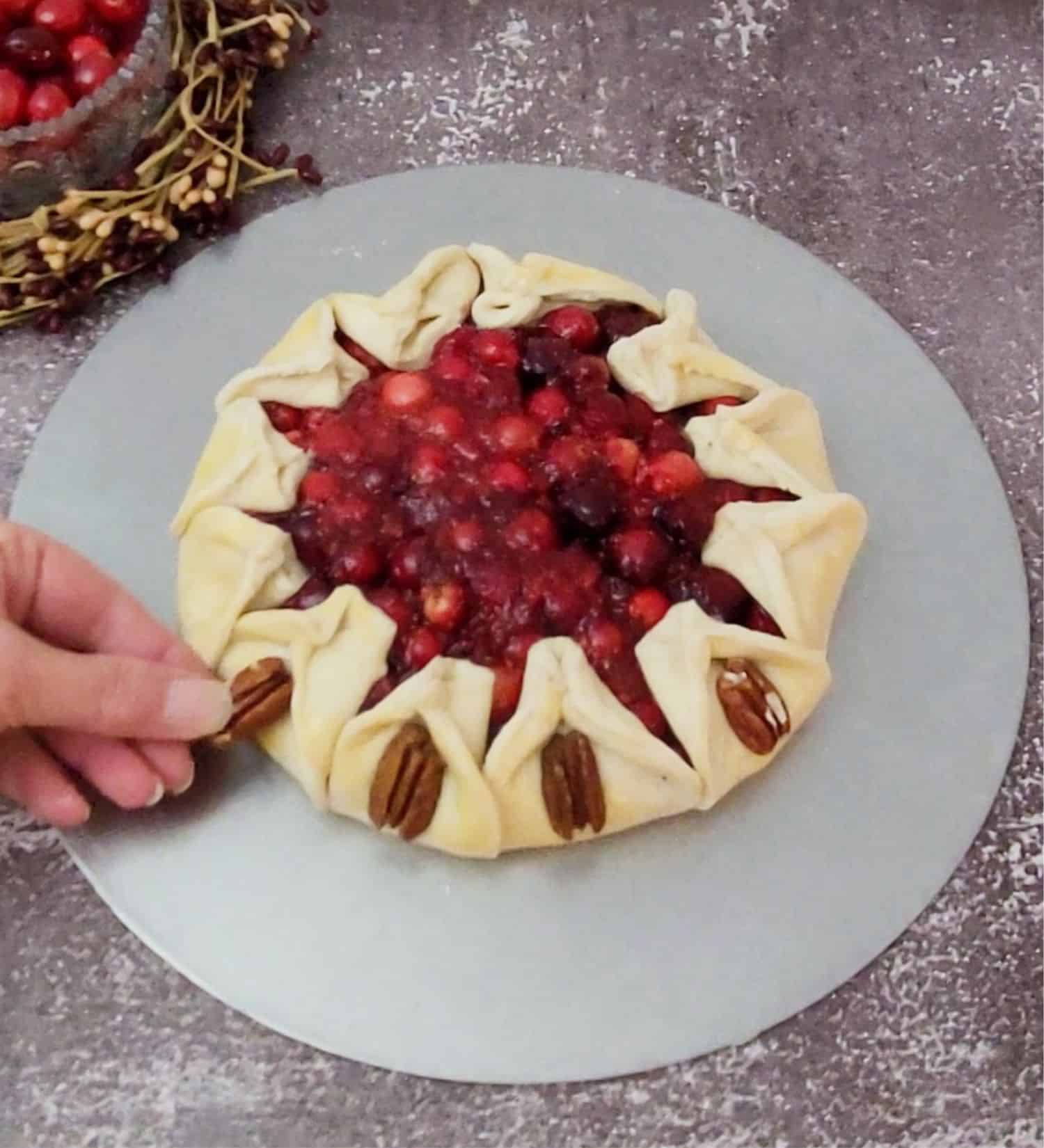 placing pecan halves on outside of galette