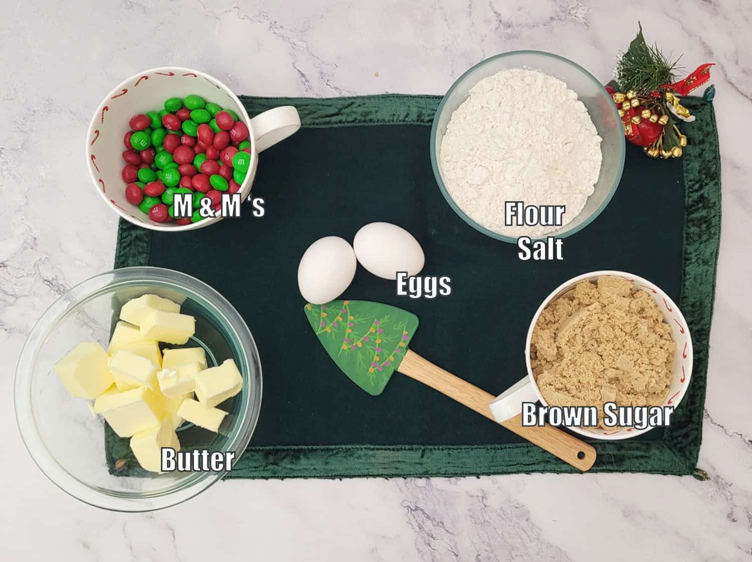 ingredients needed to make Christmas tree blondies including flour, salt, butter, eggs, brown sugar, M&Ms