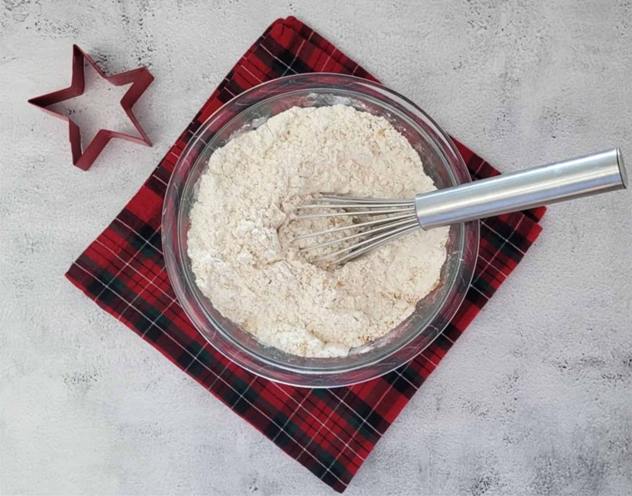 flour, baking soda and spices whisked together in a bowl