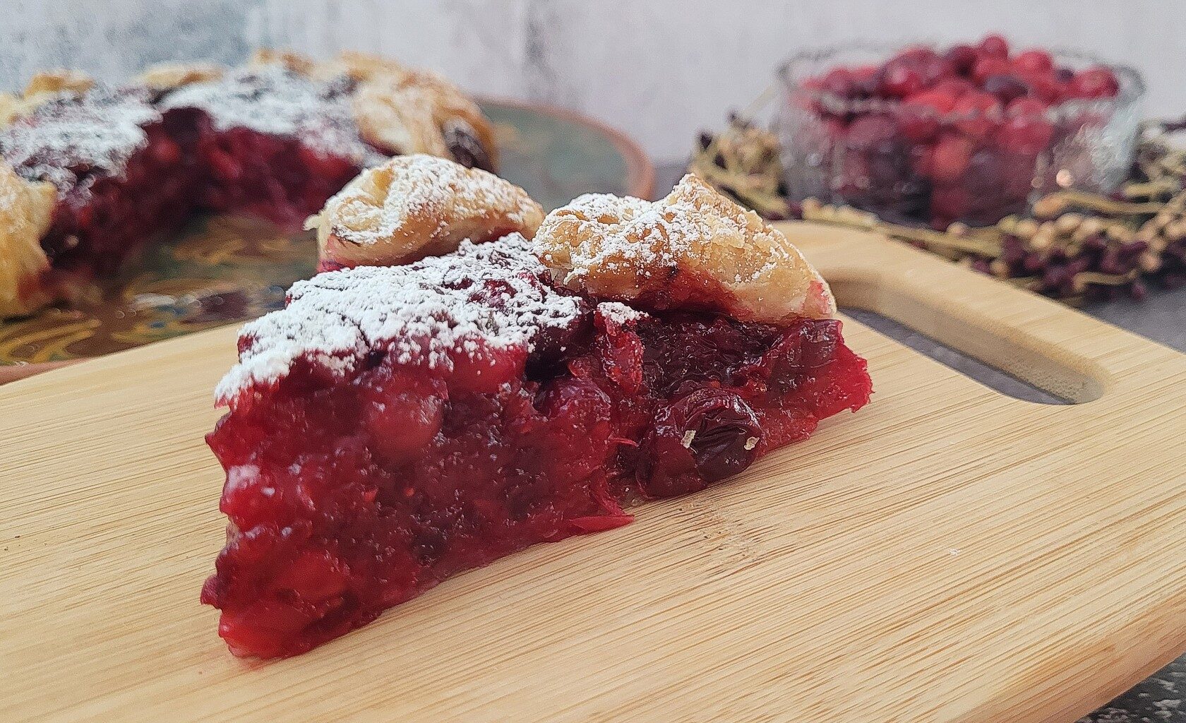 close up view of a slice of cranberry galette